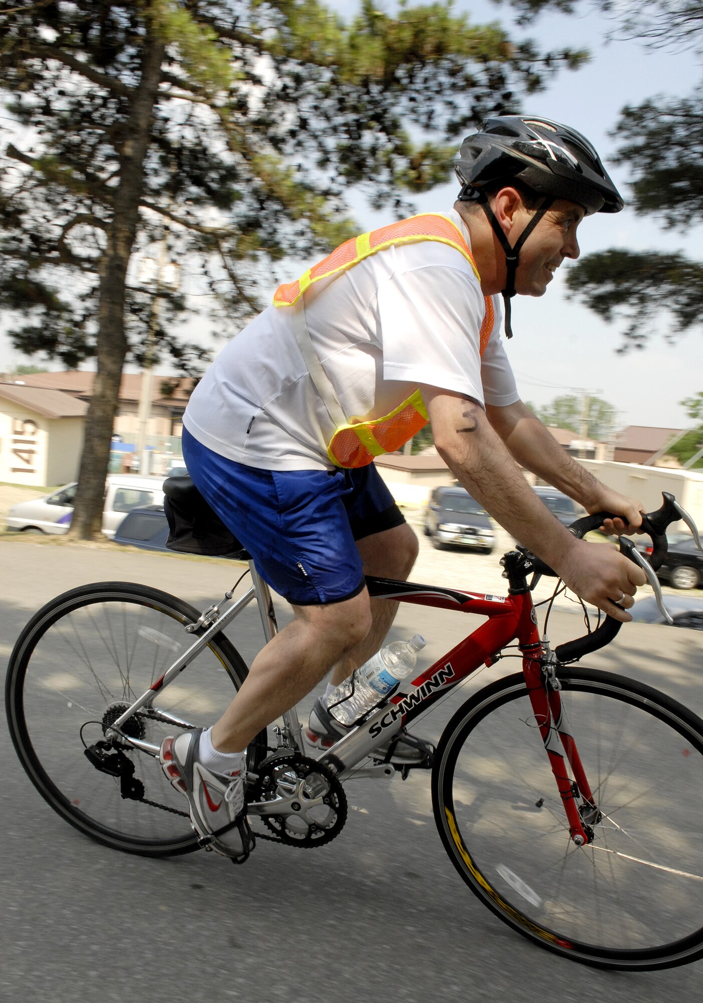A Cold Steel Triathlon participant begins the bike portion of the event June 13, at Osan Air Base, Republic of Korea. This is the second annual Cold Steel Triathlon hosted by the 3rd Battlefield Coordination Detachment - Korea (BCD-K).  More than 65 U.S., Korean, military and civilian contestants from across the peninsula competed in this event in order to test their physical and mental endurance. The triathlon consisted of a 400 meter swim, 12.4 miles bike race and 5k run. (U.S. Air Force photo/Senior Airman Stephenie Wade)