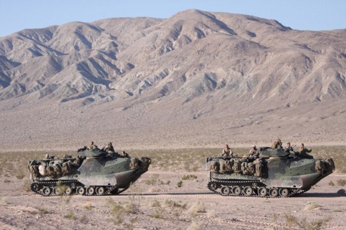 Lt. Cmdr. Kevin Kelley, officer-in-charge, Chemical Biological Incident Response Force, II Marine Expeditionary Force, accepts a United States flag at his retirement ceremony, here, June 19.  Kelley, of Stamford, Conn., helped support 48 training exercises, the Republic National Convention and three State of the Union addresses while at CBIRF.