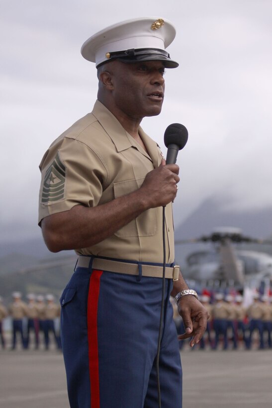 Sgt. Maj. James Futrell, newly-appointed sergeant major of U.S. Marine Corps Forces, Pacific, addresses Marines and sailors in his charge and bids farewell to Sgt. Maj. Evans McBride during the post and relief at the MCBH flightline June 19.