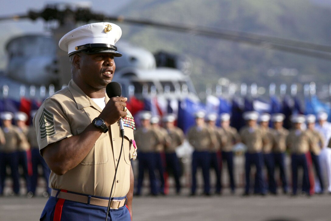 Sgt. Maj. Evans McBride, outgoing U.S. Marine Corps Forces, Pacific sergeant major, says a few last words as he retires and relinquishes his post to Sgt. Maj. James Futrell at the MCBH flightline June 19.