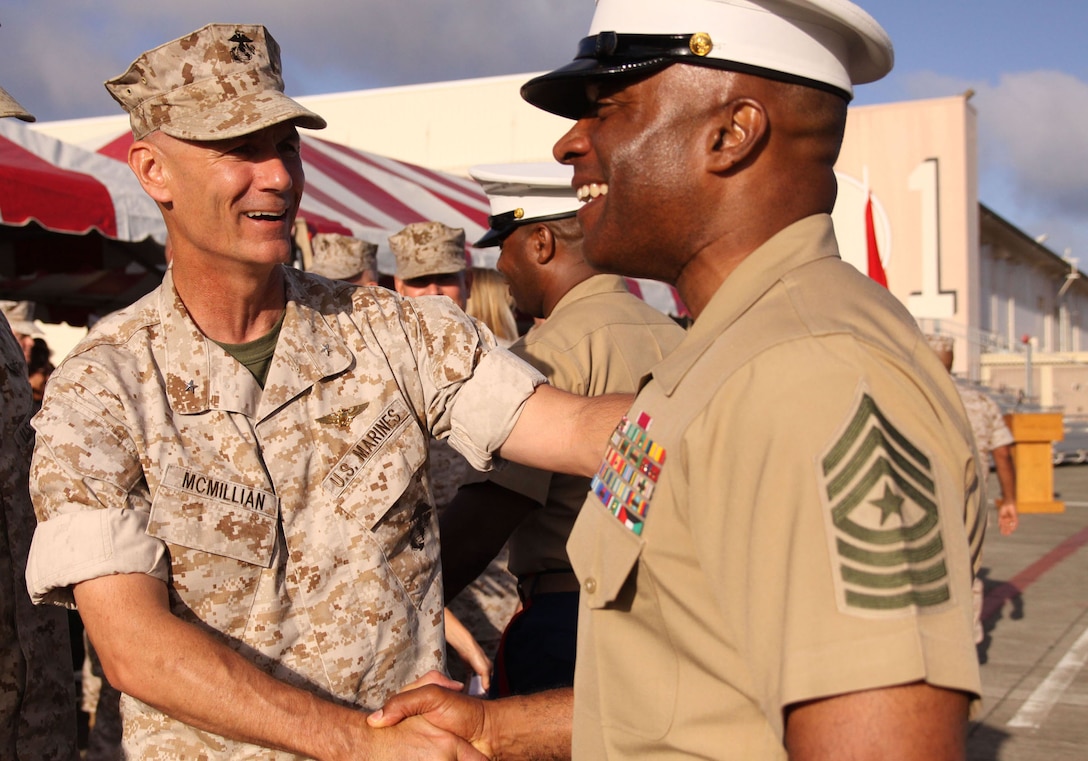 Deputy commander of U.S. Marine Corps Forces, Pacific, Brig. Gen. Rex C. McMillian (left) welcomes Sgt. Maj. James Futrell as the newly appointed sergeant major of MarForPac at the MCBH flightline June 19.
