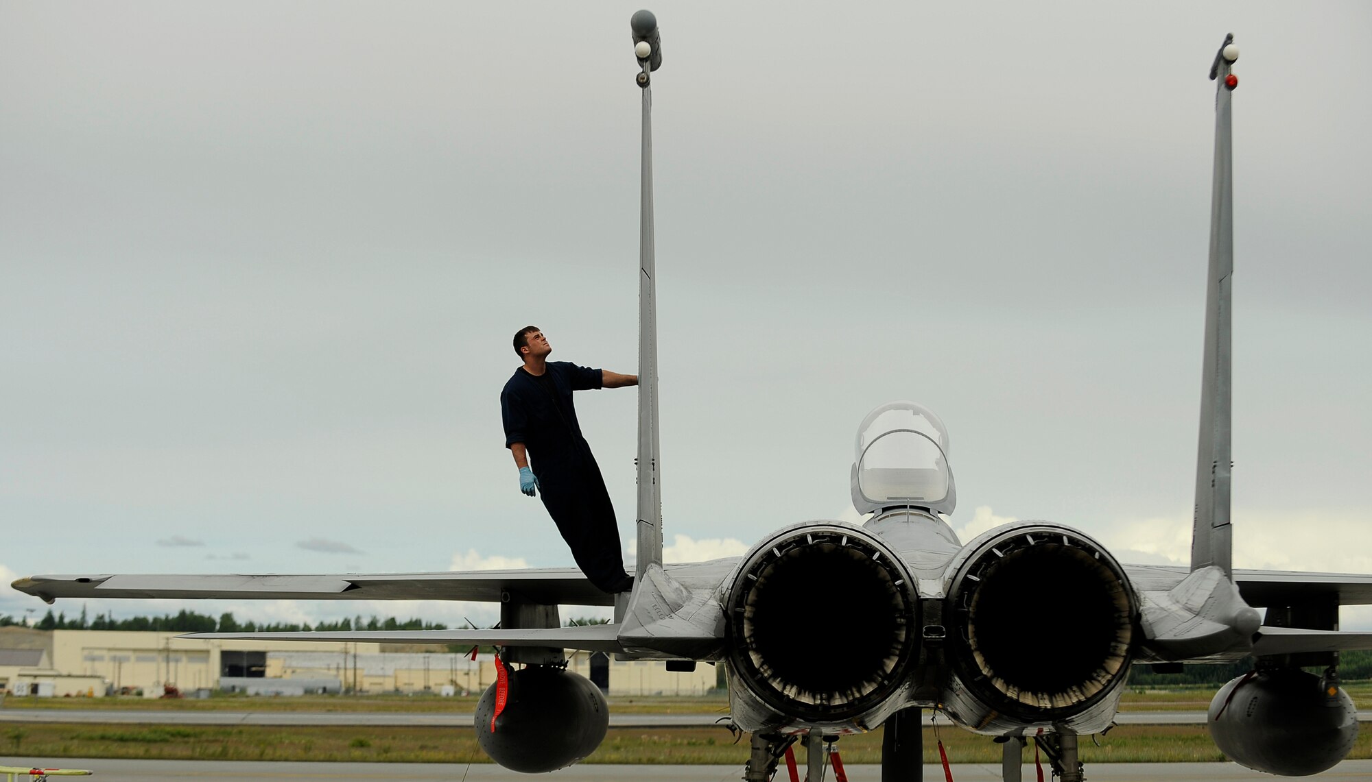 ELMENDORF AIR FORCE BASE, Alaska -- Senior Airman Zach Gartner from the 57th Aircraft Maintenance Squadron, Nellis Air Force Base, Nev., recovers an F-15 Eagle during exercise Northern Edge 2009, Elmendorf AFB, Alaska, June 18, 2009.  Northern Edge 2009 is Alaska's largest military training exercise. It prepares joint forces to respond to crises throughout the Asia-Pacific region.  (U.S. Air Force photo/Tech. Sgt. Dennis J. Henry Jr.)