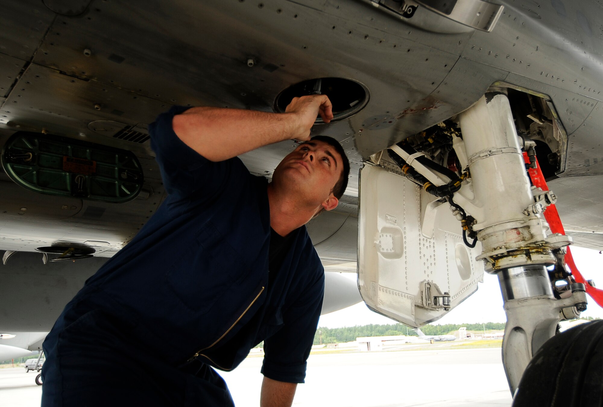 ELMENDORF AIR FORCE BASE, Alaska -- Senior Airman Zach Gartner from the 57th Aircraft Maintenance Squadron, Nellis Air Force Base, Nev., recovers an F-15 Eagle during exercise Northern Edge 2009, Elmendorf AFB, Alaska, June 18, 2009.  Northern Edge 2009 is Alaska's largest military training exercise. It prepares joint forces to respond to crises throughout the Asia-Pacific region. (U.S. Air Force photo/Tech. Sgt. Dennis J. Henry Jr.)