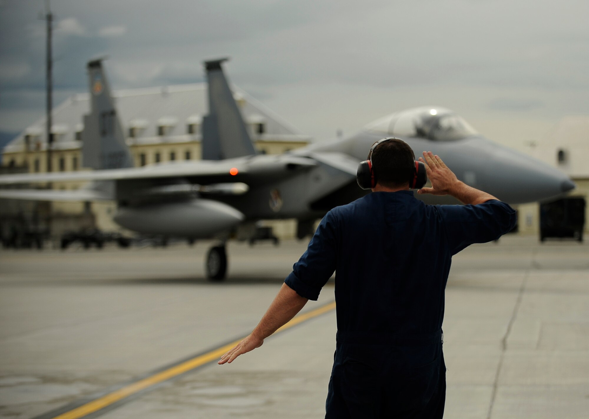 ELMENDORF AIR FORCE BASE, Alaska -- Senior Airman Zach Gartner from the 57th Aircraft Maintenance Squadron, Nellis Air Force Base, Nev., recovers an F-15 Eagle during exercise Northern Edge 2009, Elmendorf AFB, Alaska, June 18, 2009.  Northern Edge 2009 is Alaska's largest military training exercise. It prepares joint forces to respond to crises throughout the Asia-Pacific region. (U.S. Air Force photo/Tech. Sgt. Dennis J. Henry Jr.)