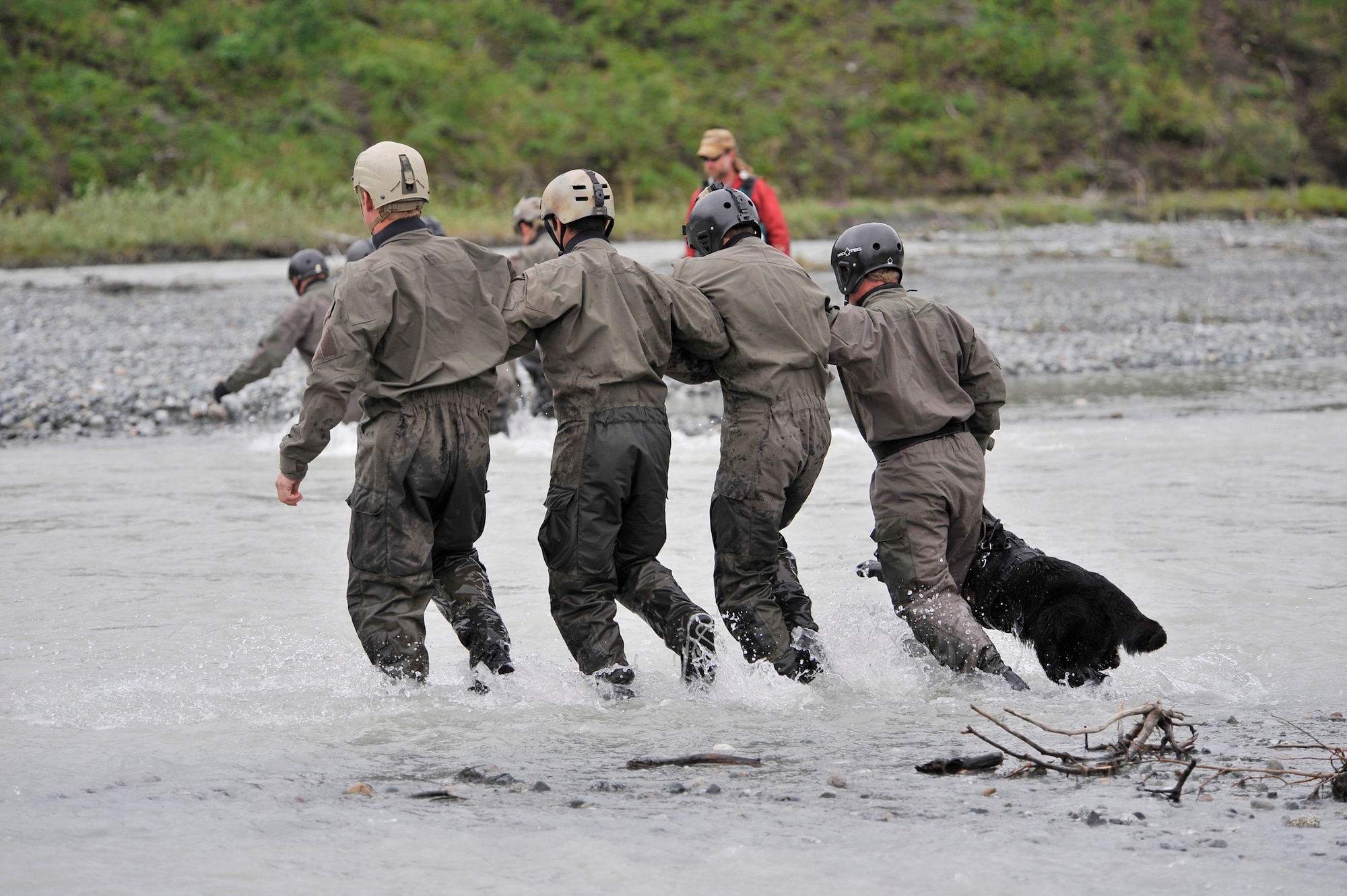 FORT WAINWRIGHT, Alaska -- A team of Navy SEALs conducts a river crossing exercise at Phelan Creek during NORTHER EDGE 2009, June 17. NE09 is a large scale exercise hosted in Alaska to improve command, control and communications between the Armed Services. The west coast based SEAL's are training for overseas operations. (U.S. Air Force photo/Staff Sgt. Christopher Boitz)