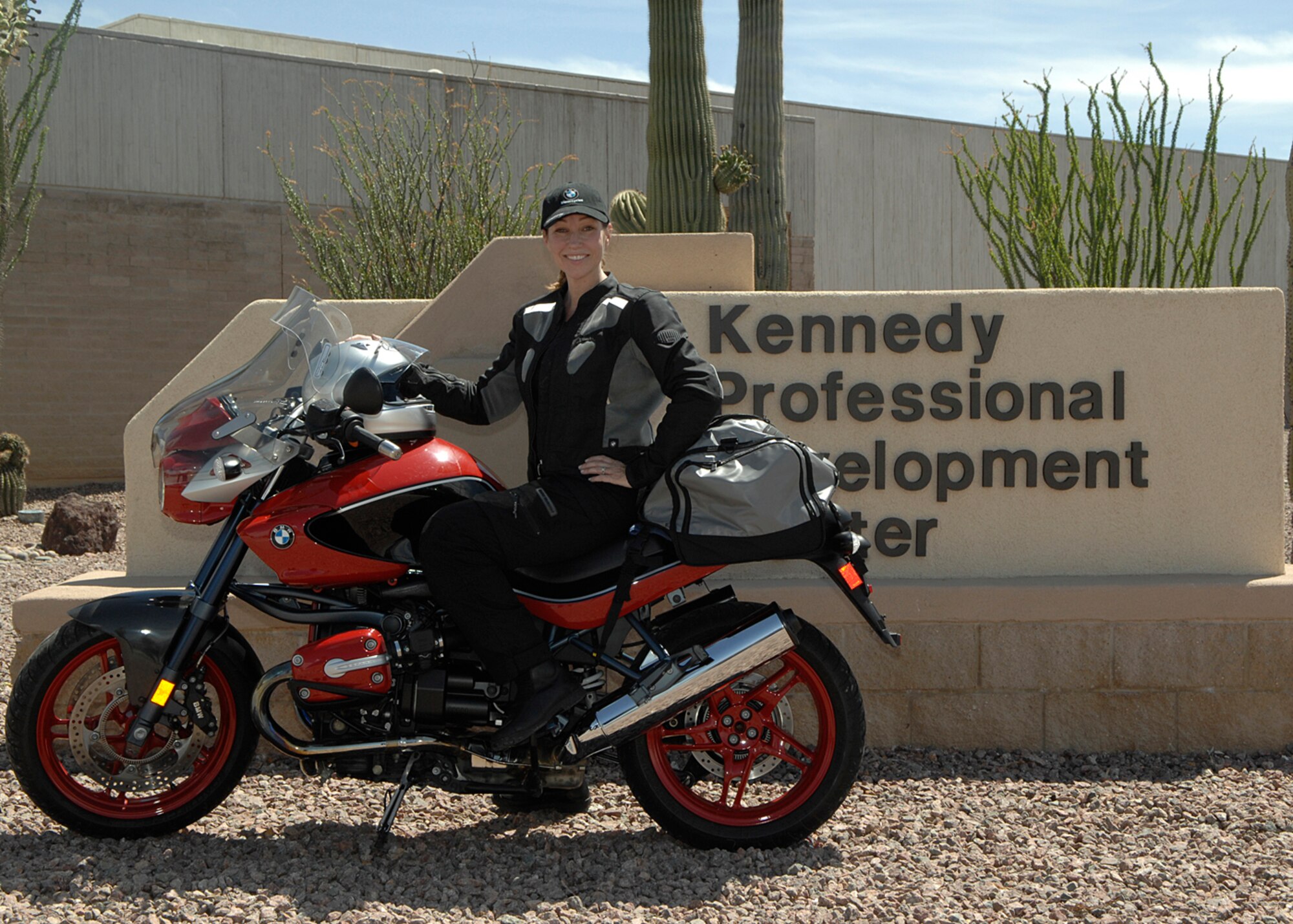 Mrs. Amy Rubin, a Michigan resident in the middle of a charitable motorcycle trip across the country, visited D-M June 9 to donate  $400 to the base education office. (U.S. Air Force photo/Senior Master Sgt. Jon Nicolussi)
