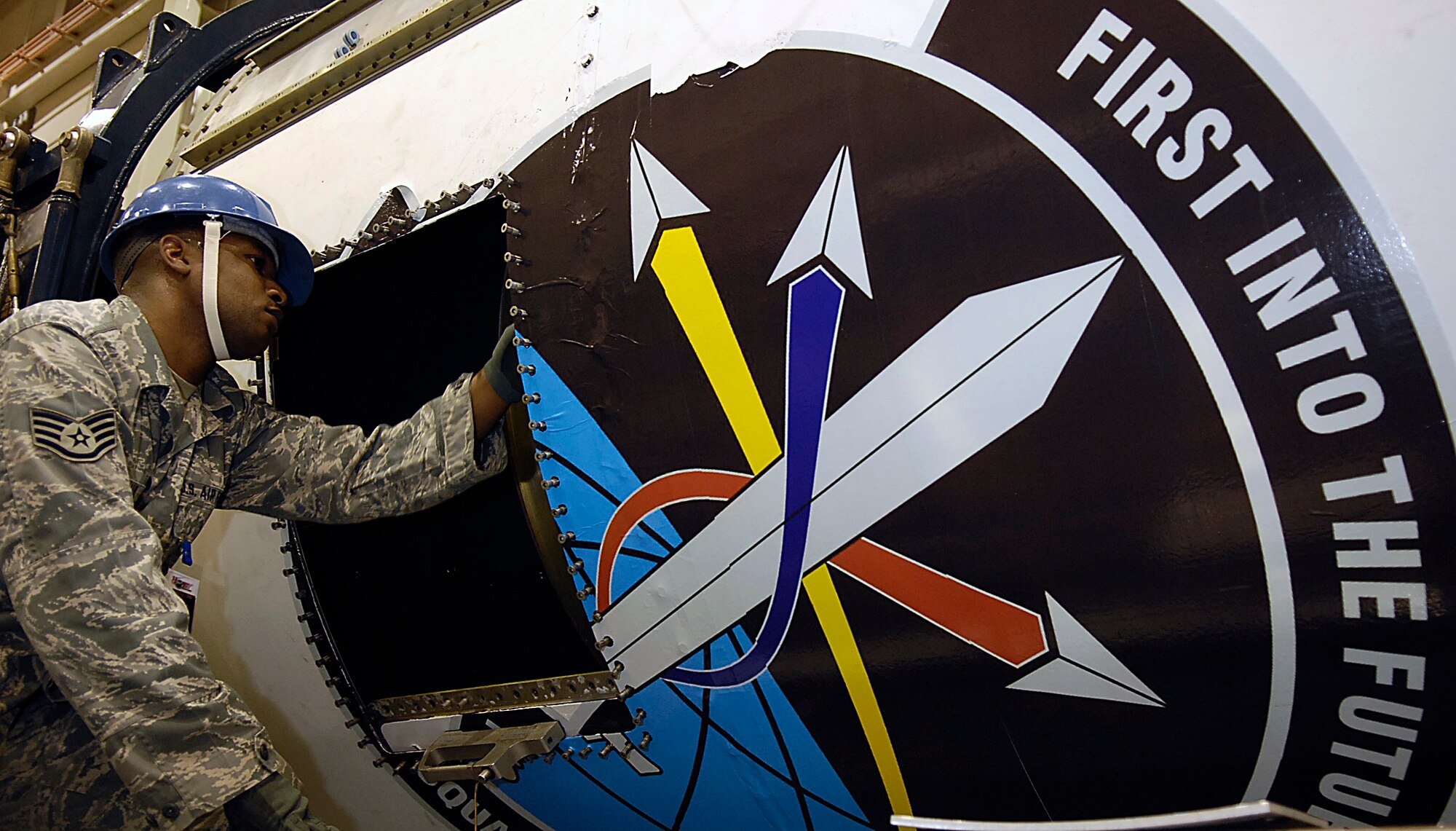 VANDENBERG AIR FORCE BASE, Calif. --  Staff Sgt. Connie McPhaul, who works in the 1st Air and Space Test Squadron maintenance flight, examines the Stage 3 assembly of the Minotaur IV Space Launch Vehicle. The 1st ASTS is the only full-service Air Force organization capable of launch and integration of several launch vehicles.  (U.S. Air Force photo/Staff Sgt. Vanessa Valentine) 
