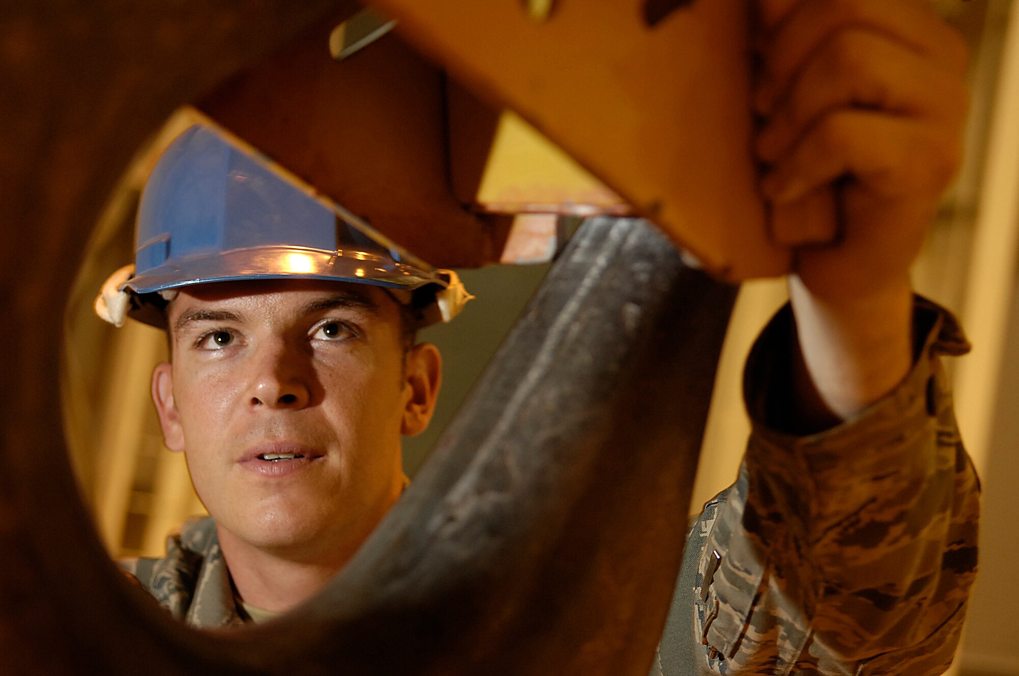 VANDENBERG AIR FORCE BASE, Calif. --  Staff Sgt. Neal Paris, who works in the 1st Air and Space Test Squadron maintenance flight, prepares a 50-ton overhead gantry crane used to lift Minotaur IV rocket motors for processing and assembly by 1st ASTS maintainers. The 1st ASTS is the only full-service Air Force organization capable of launching satellites in to space and provides the transportation handling for decommissioned intercontinental ballistic missile boosters. (U.S. Air Force photo/Staff Sgt. Vanessa Valentine)
