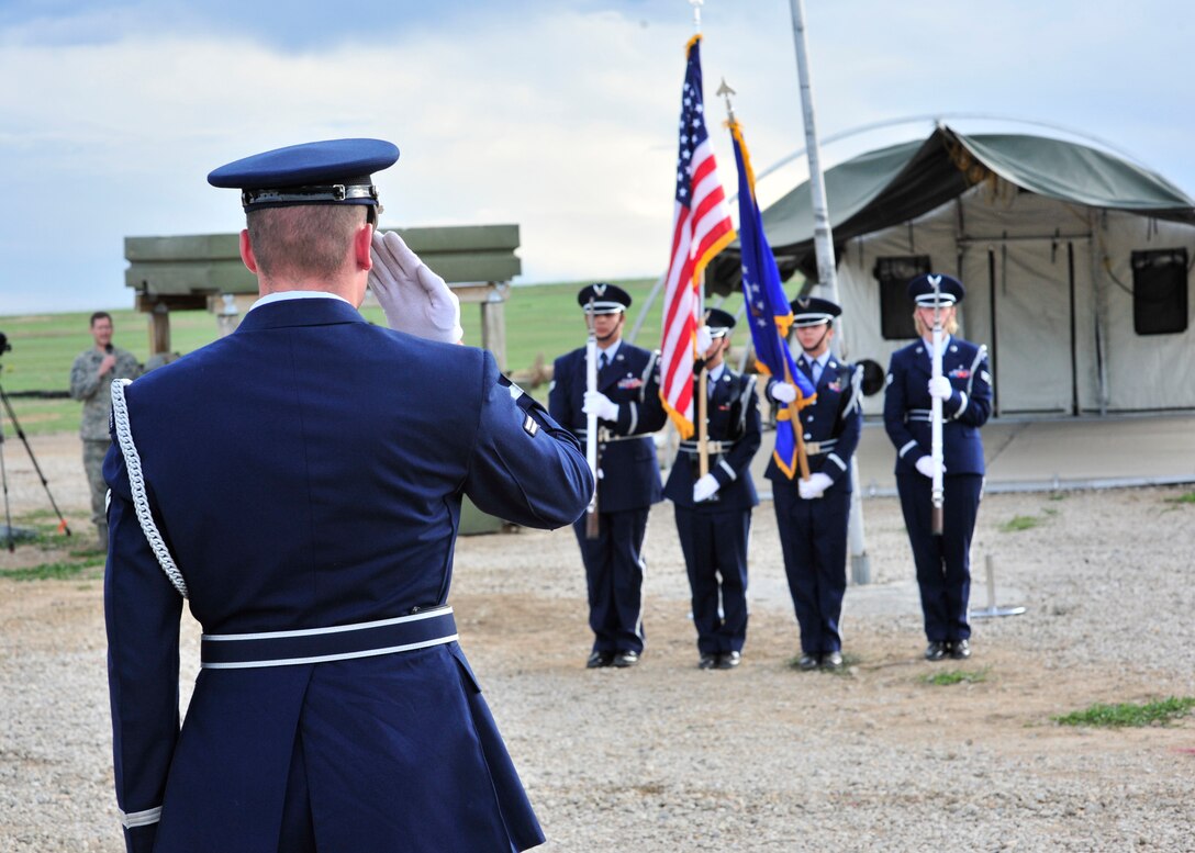 BUCKLEY AIR FORCE BASE, Colo. -- The Mile High Honor Guard present the Colors at the Combat Dining-in May 29 at Camp Rattlesnake here. More than 100 people showed up for the event. (U.S. Air Force photo by Senior Airman Alex Gochnour)