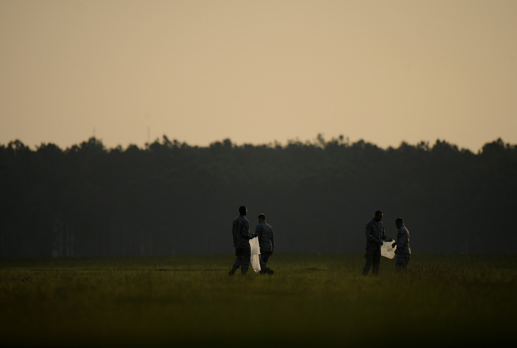 MOODY AIR FORCE BASE, Ga. -- Airmen pick up objects around the flightline during a foreign object debris walk here June 19. Airmen searched for loose rubble, trash, lost items and any other materials that did not belong on the flightline. (U.S. Air Force photo by Senior Airman Gina Chiaverotti)