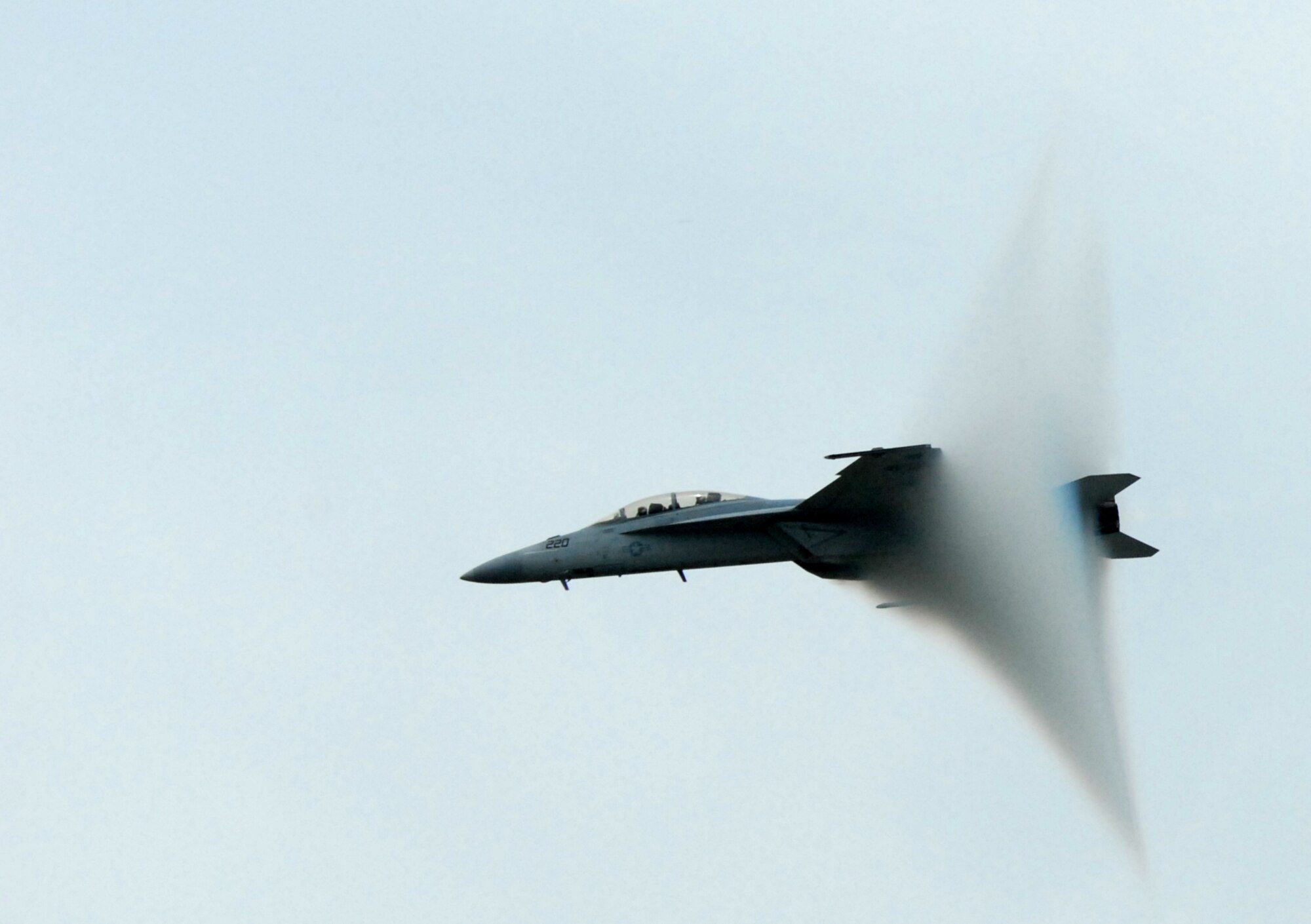 A Navy Tactical Demonstration Team F/A-18 Super Hornet tweaks the sky as it flies at ultra-high speeds through the air above Dover Air Force Base June 19. The Navy team compliments the U.S. Air Force Thunderbirds and other acts at the base’s Open House and Air Show. (U.S. Air Force photo/Tech. Sgt. Kevin Wallace)