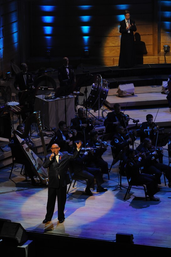 Irish tenor Ronan Tynan performs with the United States Air Force Band June 17 at the Music Center at Strathmore in North Bethesda, Md. For the third consecutive year, the Band has partnered with Maryland Public Television to create a musical tribute to America's veterans. (U.S. Air Force photo by Senior Airman Marleah Miller)
