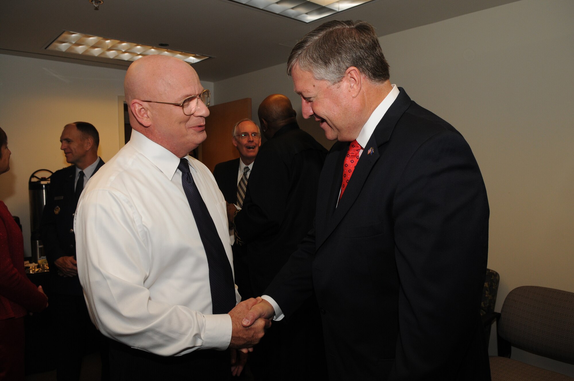 Col. Dennis Layendecker, United States Air Force Band commander, shakes hands with Secretary of the Air Force Michael B. Donley (right), before a concert June 17 at the Music Center at Strathmore in North Bethesda, Md. For the third consecutive year, the Band has partnered with Maryland Public Television to create a musical tribute to America's veterans. (U.S. Air Force photo by Senior Airman Marleah Miller)