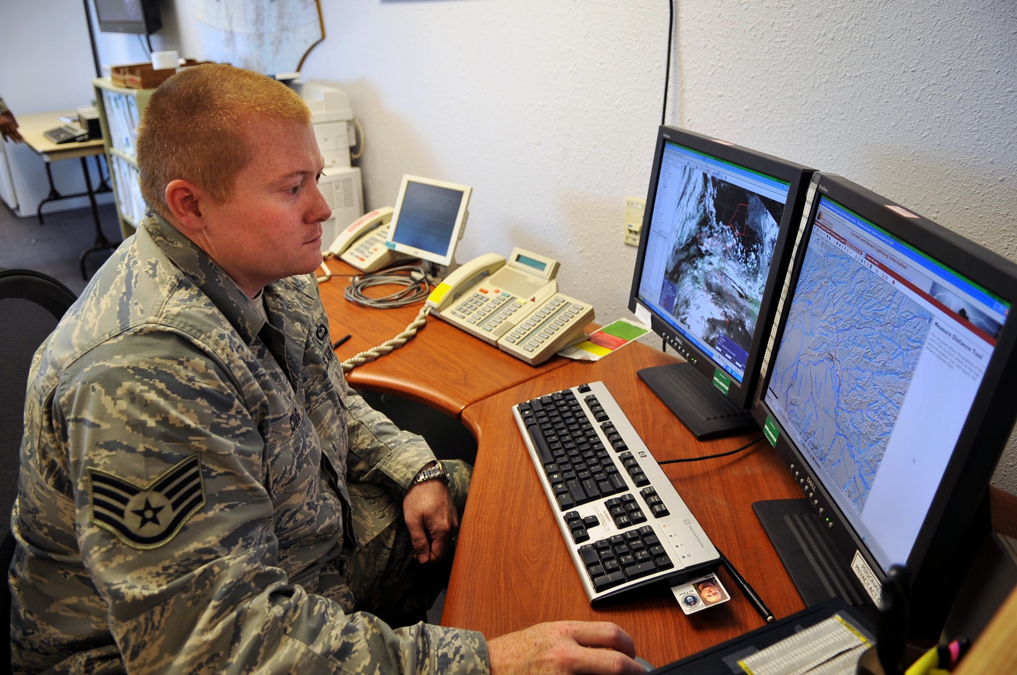 Air Force Staff Sgt. David Craig, weather forecaster with the 611th Air and Space Operations Center, looks over weather data June 17 at the weather flight office on Elmendorf Air Force Base, Alaska. (U.S. Air Force photo/Master Sgt. Shane Cuomo)