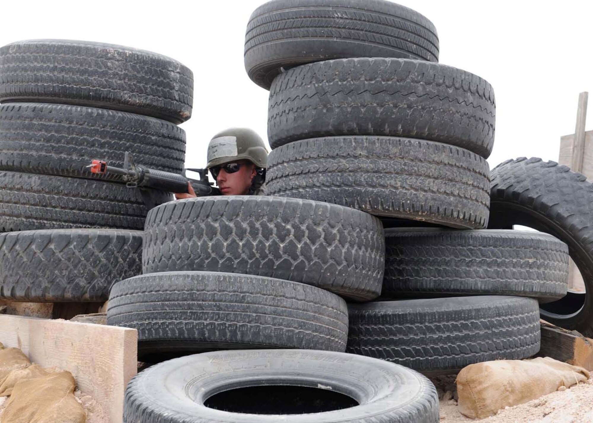 A member of Team Holloman performs security during the Phase 11 operational readiness exercise at the Civil Engineer Pit, June 18, at Holloman Air Force Base, N.M. The last day of the exercise was composed of conventional attacks such as missile, mortar and small arms. The exercise was designed to provide a more realistic form of training to members who will be deploying in the future.(U.S. Air Force photo/Senior Airman Rachel Kocin)