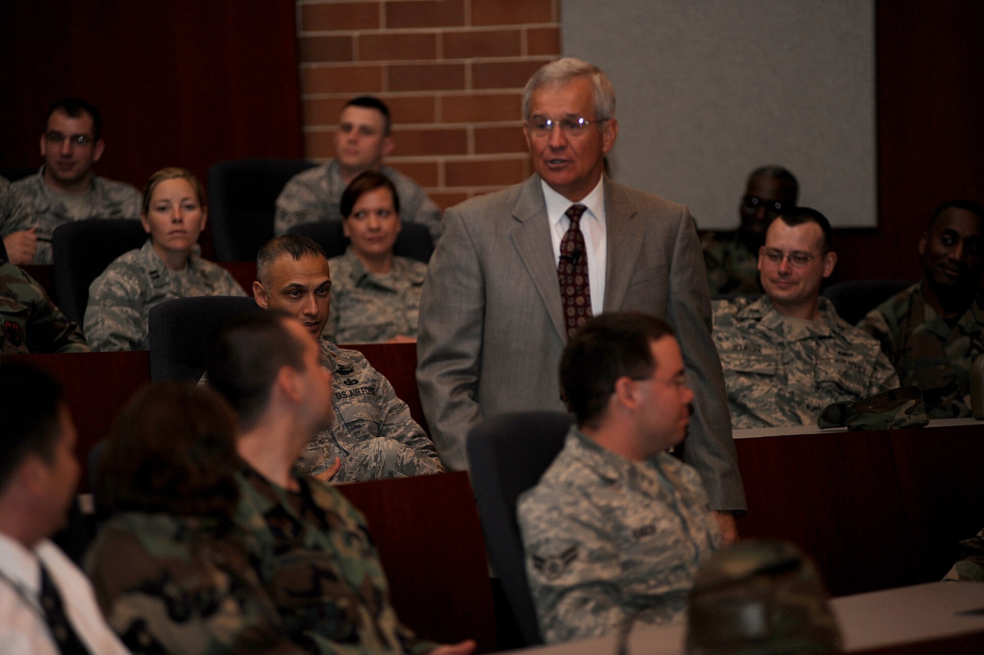 Lieutenant General (Retired) Chris Kelly spoke about leadership, trust and integrity to a packed crowd of more than 275 people in the U.S. Air Force Expeditionary Center's Grace Peterson hall, June 19.  Gen. Kelly was the third in a series of professional development speakers to address the center, students and staff as part of the on-going 15th Anniversary celebration. (U.S. Air Force Photo/Staff Sgt. Nathan G. Bevier) 