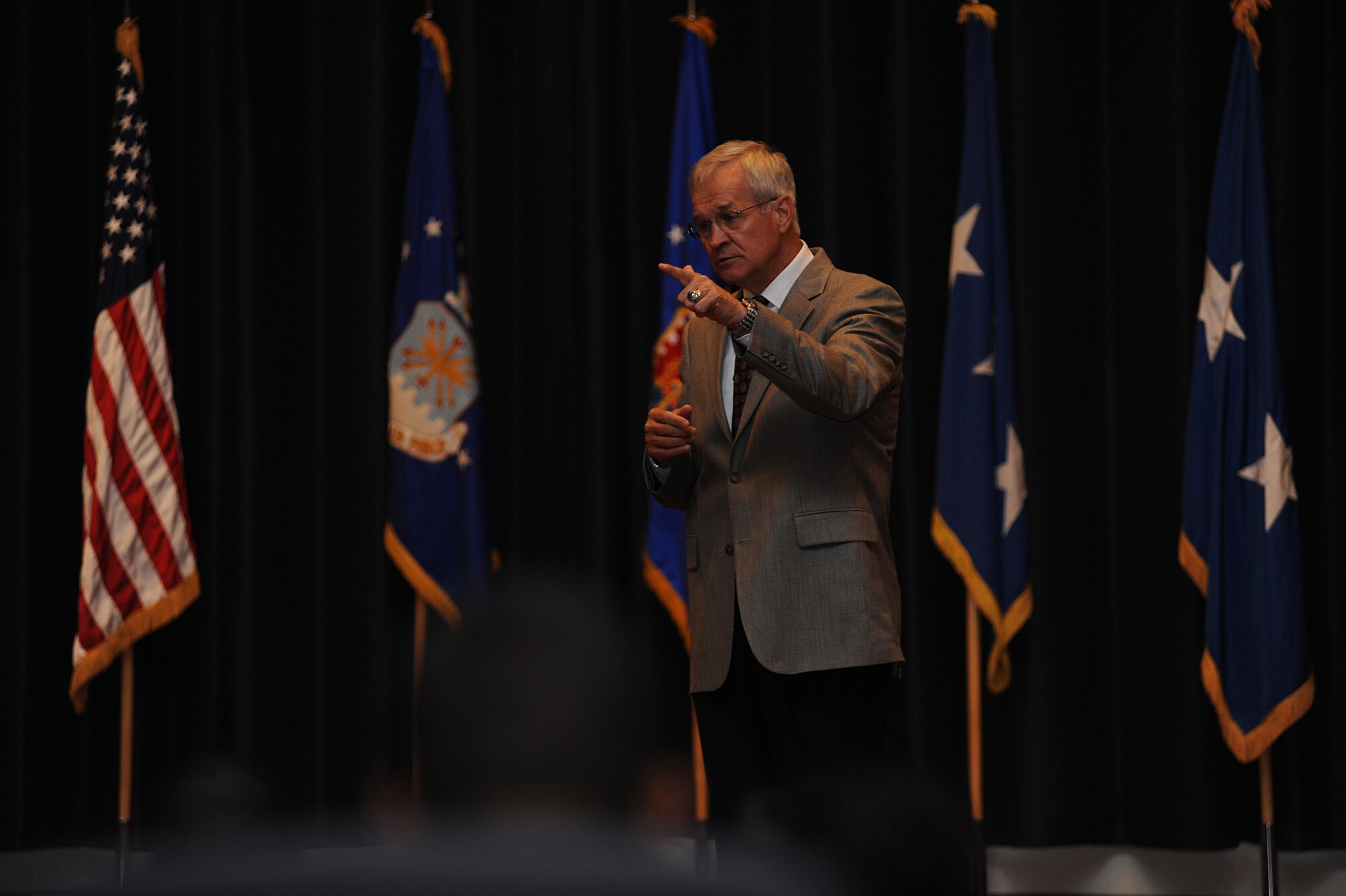 Lieutenant General (Retired) Chris Kelly spoke about leadership, trust and integrity to a packed crowd of more than 275 people in the U.S. Air Force Expeditionary Center's Grace Peterson hall, June 19.  Gen. Kelly was the third in a series of professional development speakers to address the center, students and staff as part of the on-going 15th Anniversary celebration. (U.S. Air Force Photo/Staff Sgt. Nathan G. Bevier) 