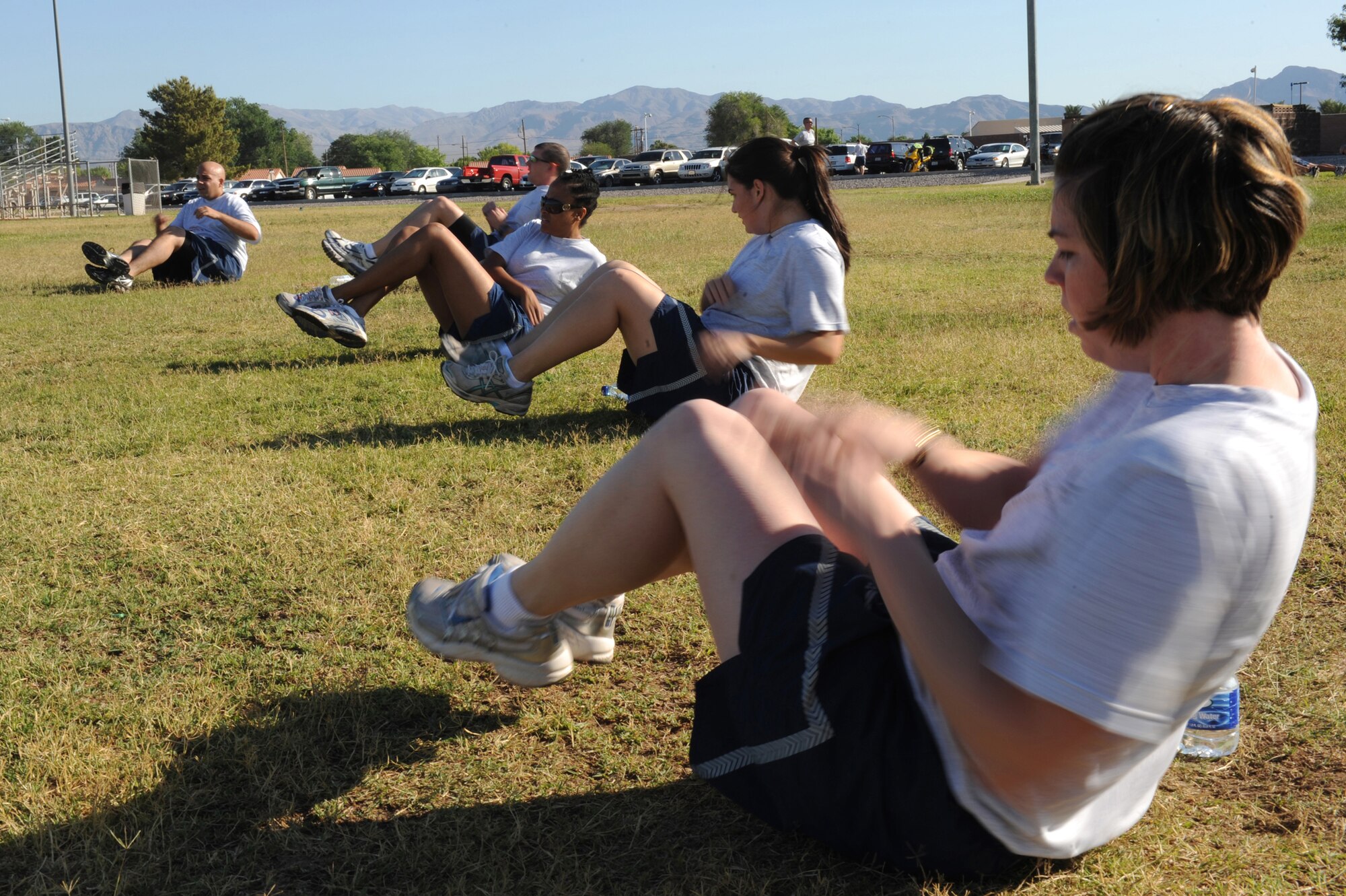 Members of the 99th Comptroller Squadron participate in group physical training at Nellis Air Force Base, Nev.          
(U.S. Air Force Photo/Senior Airman Brian Ybarbo, released)
