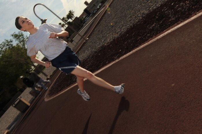 U.S. Air Force 2nd Lt. Sarah Kline a vehicle management and analyst officer assigned to the 99th Logistics and Readiness Squadron runs during physical training at Nellis Air Force Base, Nev.      (U.S. Air Force Photo/Senior Airman Brian Ybarbo, released)