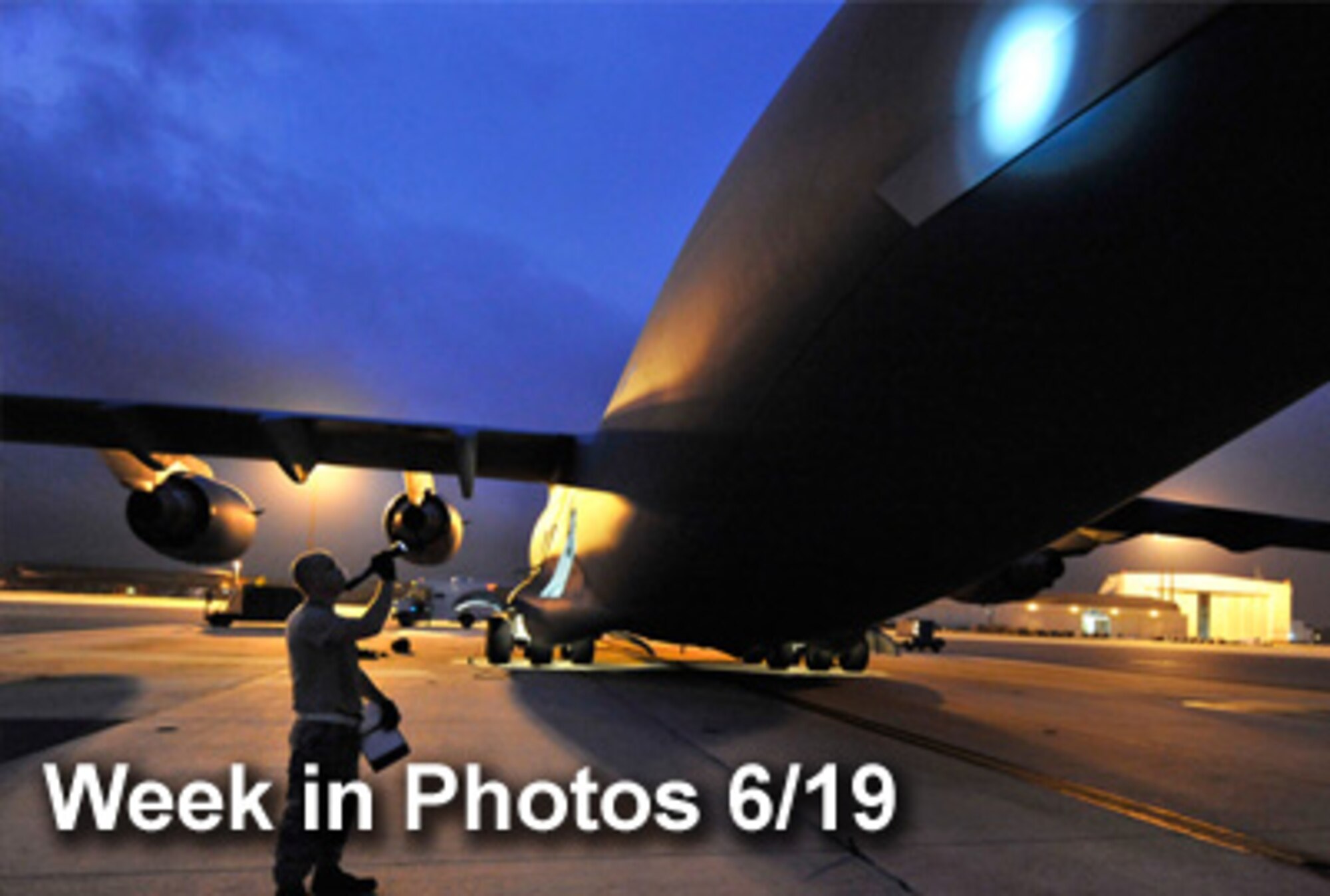 Air Force Week in Photos for June 19 highlights photos from around the Air Force. In this photo by James M. Bowman, Senior Airman Kyle Robinson inspects the exterior of a C-17 Globemaster III for missing screws or damage. (U.S. Air Force illustration)