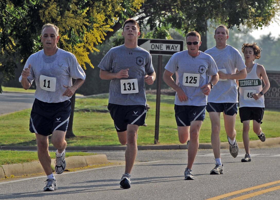LANGLEY AIR FORCE BASE Va. -- Langley personnel keep a steady pace during the 2009 Langley Chief's Group Annual Spring Fun Run here June 19.  More than 150 runners participated in the 5K.  The Chief's Group will use the proceeds to fund professional military education programs such as Airman Leadership School, First Term Airman Center and Non-commissioned Officer Academy graduation ceremonies. (U.S. Air Force photo/Airman 1st Class Jonathan Koob)