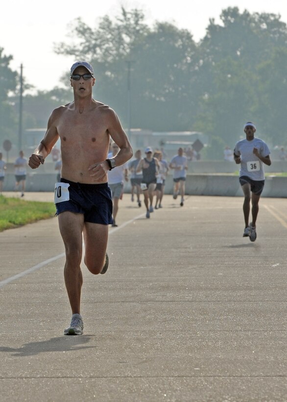 LANGLEY AIR FORCE BASE Va. -- Maj. Robert Schabron, 1st Force Support Squadron manpower personnel flight chief, pulls away from the pack during the 2009 Langley Chief's Group Annual Spring Fun Run here June 19.  More than 150 runners participated in the 5K.  The Chief's Group will use the proceeds to fund professional military education programs such as Airman Leadership School, First Term Airman Center and Non-commissioned Officer Academy graduation ceremonies. (U.S. Air Force photo/Airman 1st Class Jonathan Koob)