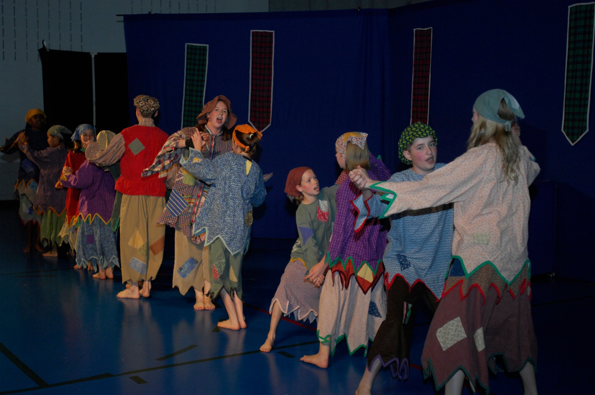 MINOT AIR FORCE BASE, ND -- Children from the base perform a play production entitled "Cinderella" at the David C. Jones Youth Center here June 12. The Missoula Children's Theater sponsored the event. The MCT uses the performing arts as a vehicle to help children develop the life-skills necessary to answer challenges they may face in life. (U.S. Air Force Photo by: Airman 1st Class Jesse Lopez)  