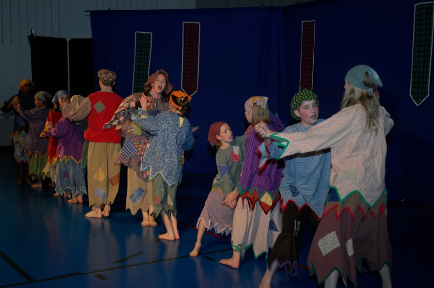 MINOT AIR FORCE BASE, ND -- Children from the base perform a play production entitled "Cinderella" at the David C. Jones Youth Center here June 12. The Missoula Children's Theater sponsored the event. The MCT uses the performing arts as a vehicle to help children develop the life-skills necessary to answer challenges they may face in life. (U.S. Air Force Photo by: Airman 1st Class Jesse Lopez)  