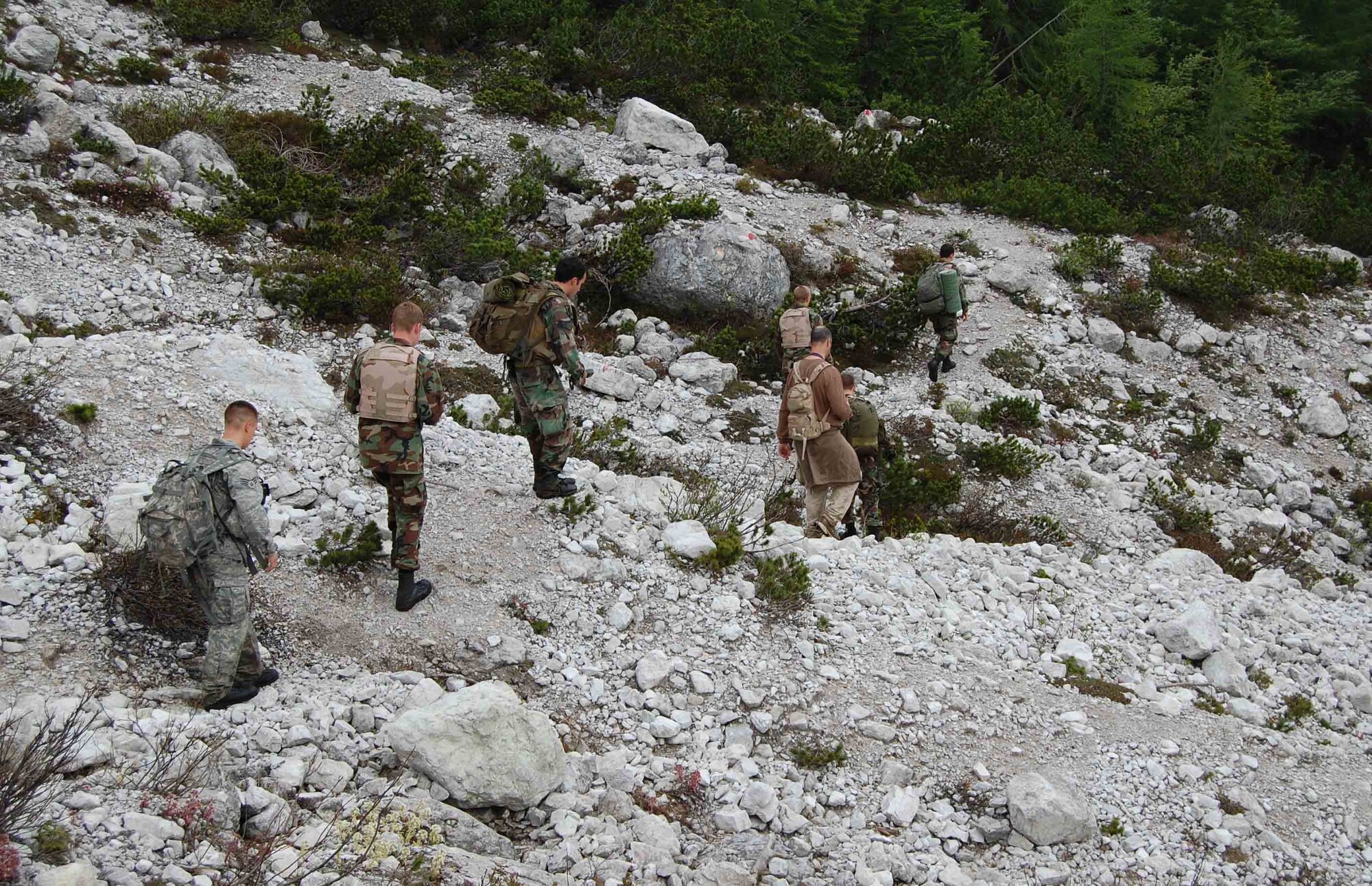Joint terminal attack controllers with the 8th Air Support Operations Squadron walk through the Italian dolomite mountains with U.S. Air Force Academy cadets as part of an exercise in conjunction with the cadets' Operation Air Force visit of the base June 11. (U.S. Air Force photo/Staff Sgt. Lindsey Maurice)
