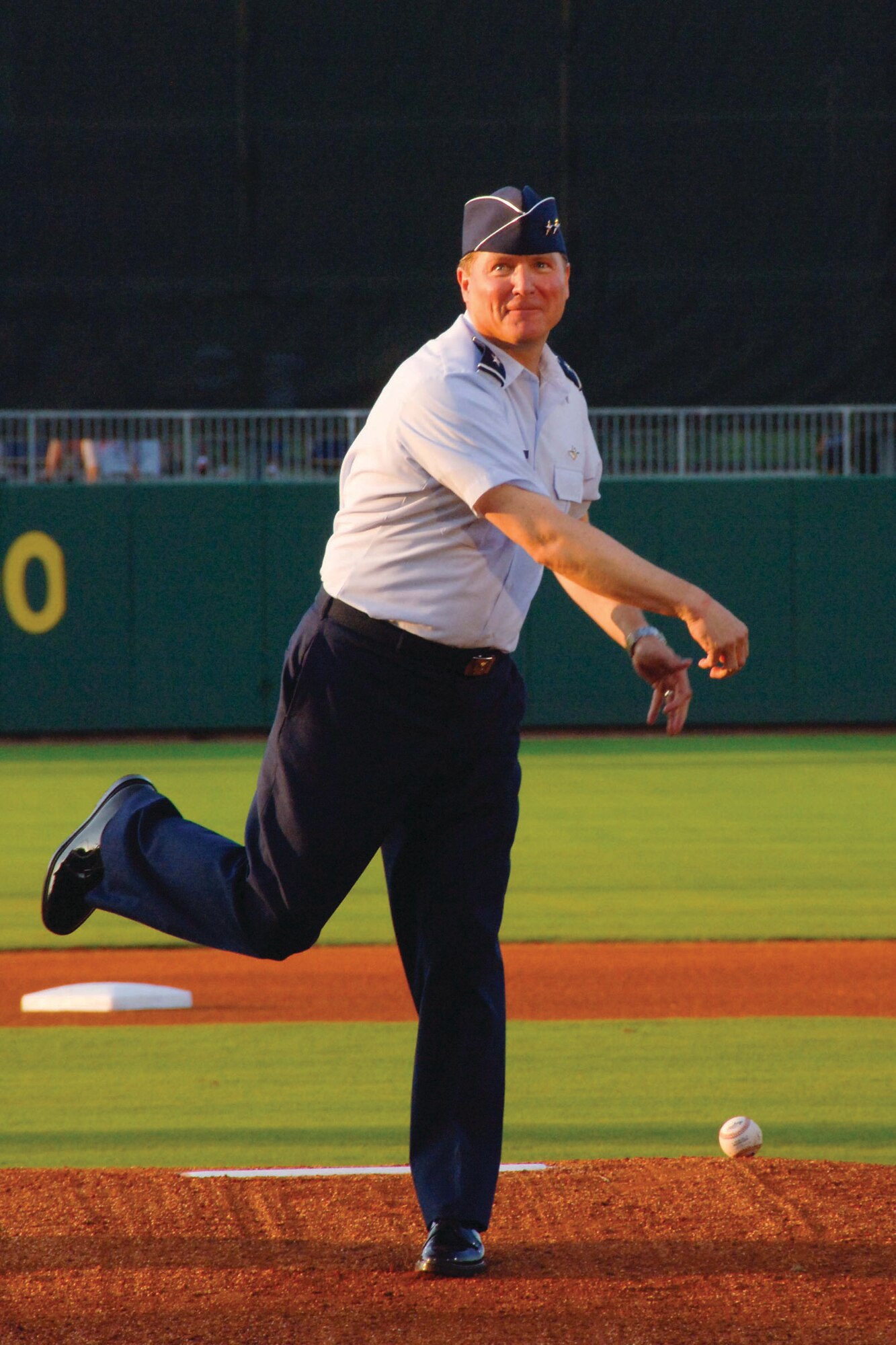 Spaatz Center commander, Maj. Gen. Maury Forsyth throws out the first pitch at the Montgomery Biscuits annual Military Appreciation Night baseball game. The Biscuits, a double-A minor league team affiliated with the major league Tampa Bay Rays, took on the Chattanooga Lookouts, losing 3-2. (U.S. Air Force photo/Donna Burnett)