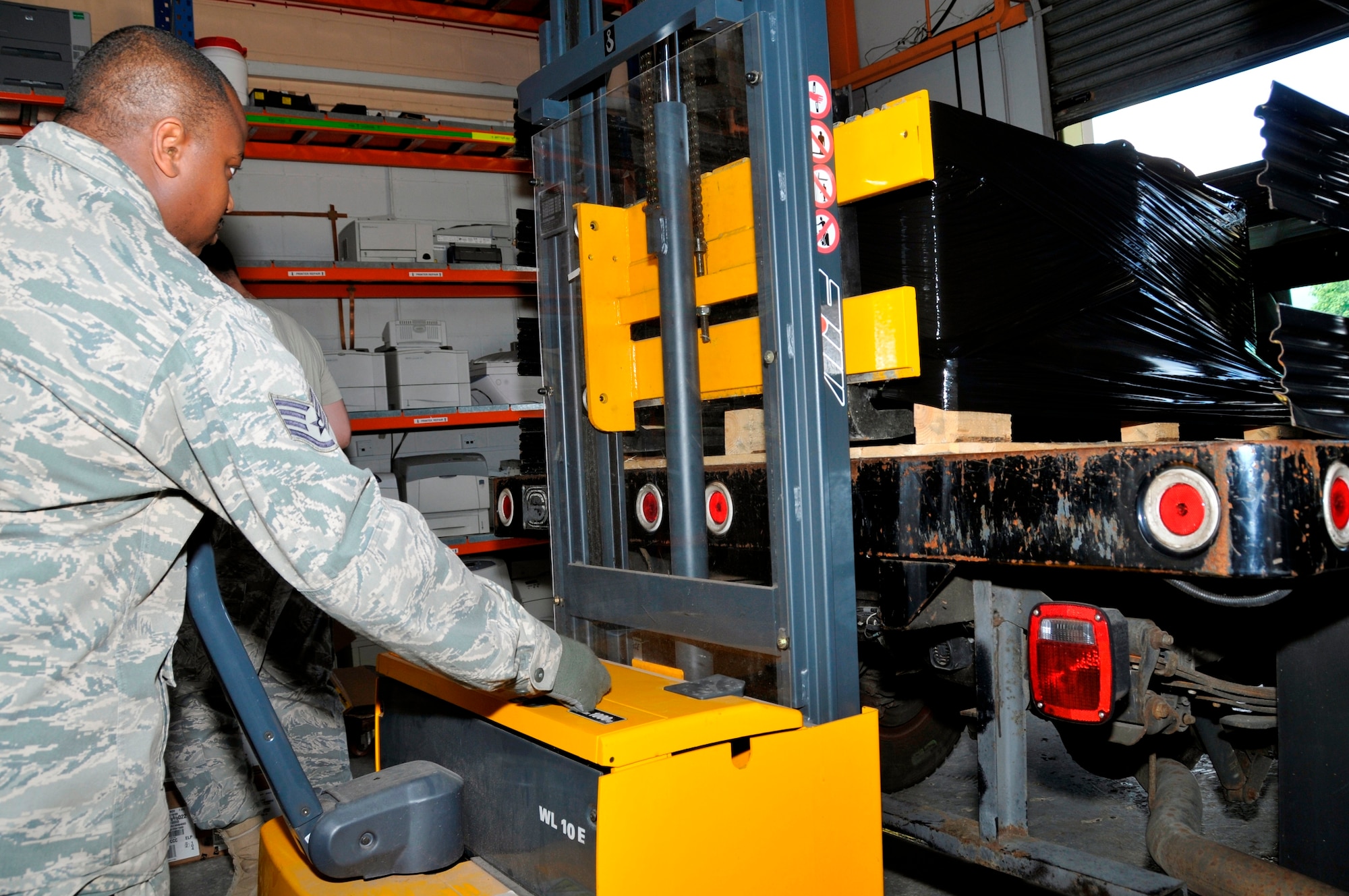 Staff Sgt. Leo Starks, 48th Communication Squadron asset management assistant non-commissioned officer in charge, uses a self propelled pallet jack to load a pallet of computers onto a truck June 16, 2009 at RAF Lakenheath, England. The computers will be reused, donated, sold or disposed of at the Defense Reutilization and Marketing Service Center. (U.S. Air Force photo by Airman 1st Class Perry Aston) 