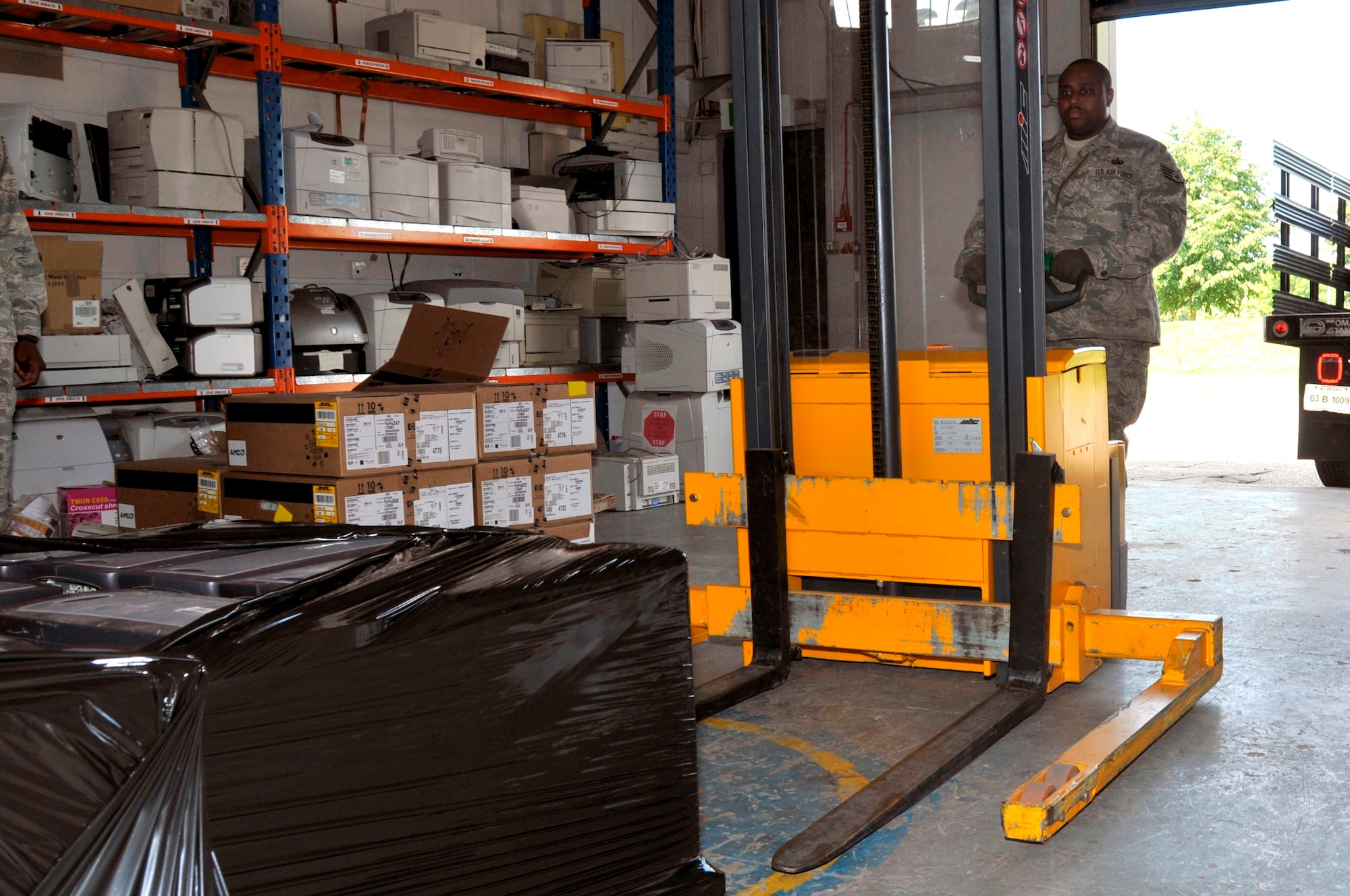 Staff Sgt. Leo Starks, 48th Communication Squadron asset management assistant non-commissioned officer in charge, uses a self-propelled pallet jack to load a pallet of computers to a waiting truck June 16, 2009 at RAF Lakenheath, England. The computers will be sent to the Defense Reutilization and Marketing Service Center. The Computers will be reused, donated, sold or disposed of at the DRMO Center. (U.S. Air Force photo by Airman 1st Class Perry Aston) 