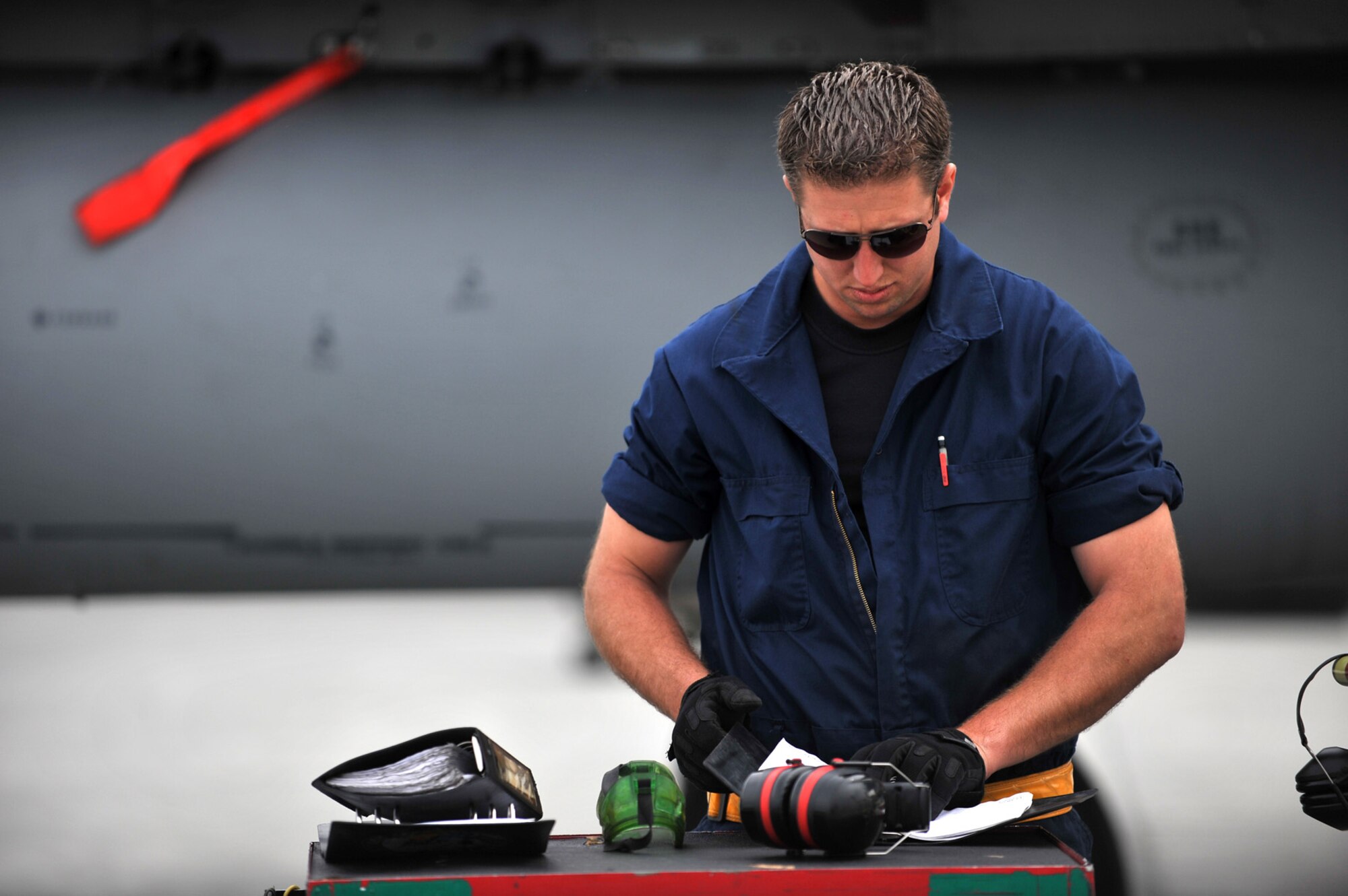 090618-F-2034C-127
Staff Sgt. Travis Wright looks over a maintenance log for his F-15C Eagle June 18, 2009 during Exercise Northern Edge 09 held at Elmendorf Air Force Base, Alaska. Sgt. Wright is a crew chief from the 57th Aircraft Maintenance Squadron, Nellis AFB. Northern Edge is Alaska?s largest military training exercise that prepares joint forces to respond to crises throughout the Asia-Pacific region. (U.S. Air Force photo/ MSgt Shane A. Cuomo) RELEASED
