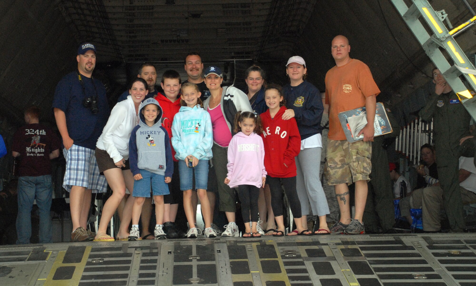 The Gibbs family gather in the nose of a C-5 Galaxy at Dover Air Force Base’s Open House and Air Show June 20. The Gibbs family traveled from New Hampshire and New Jersey to attend the show. (U.S. Air Force photo/Tech. Sgt. Kevin Wallace)

