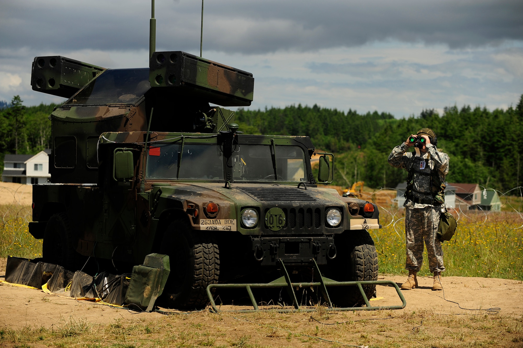 U.S. Army Specialist Jonathan Browder, Non-Commissioned Officer in Charge of Avenger Crew, 263rd Ant Air Missile Defense Command, South Carolina National Guard, search the sky for simulated enemy aircraft during Exercise Amalgam Dart, Camp Rilea, Oregon, June 17, 2009.  (U.S. Air Force photo by Technical Sgt. Sean M. Worrell) 