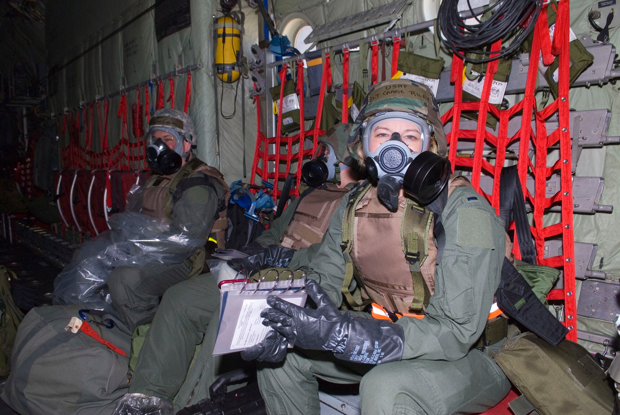 Airmen of the 109th Aeromedical Evacuation Squadron wear Mission-Oriented  Protective Posture level 4 meaning wearnig the full gas mask, gloves, and boots in bay of a C-130 Hercules May 16, 2009. Hundreds of men and women from the Minnesota Air National Guard unit joined otheres from Scott Air Force Base, Illinois for Readiness Safeguard in preparation for an Operational Readiness Inspection. USAF Official photo by Technical Sgt. Erik Gudmundson.(Released)