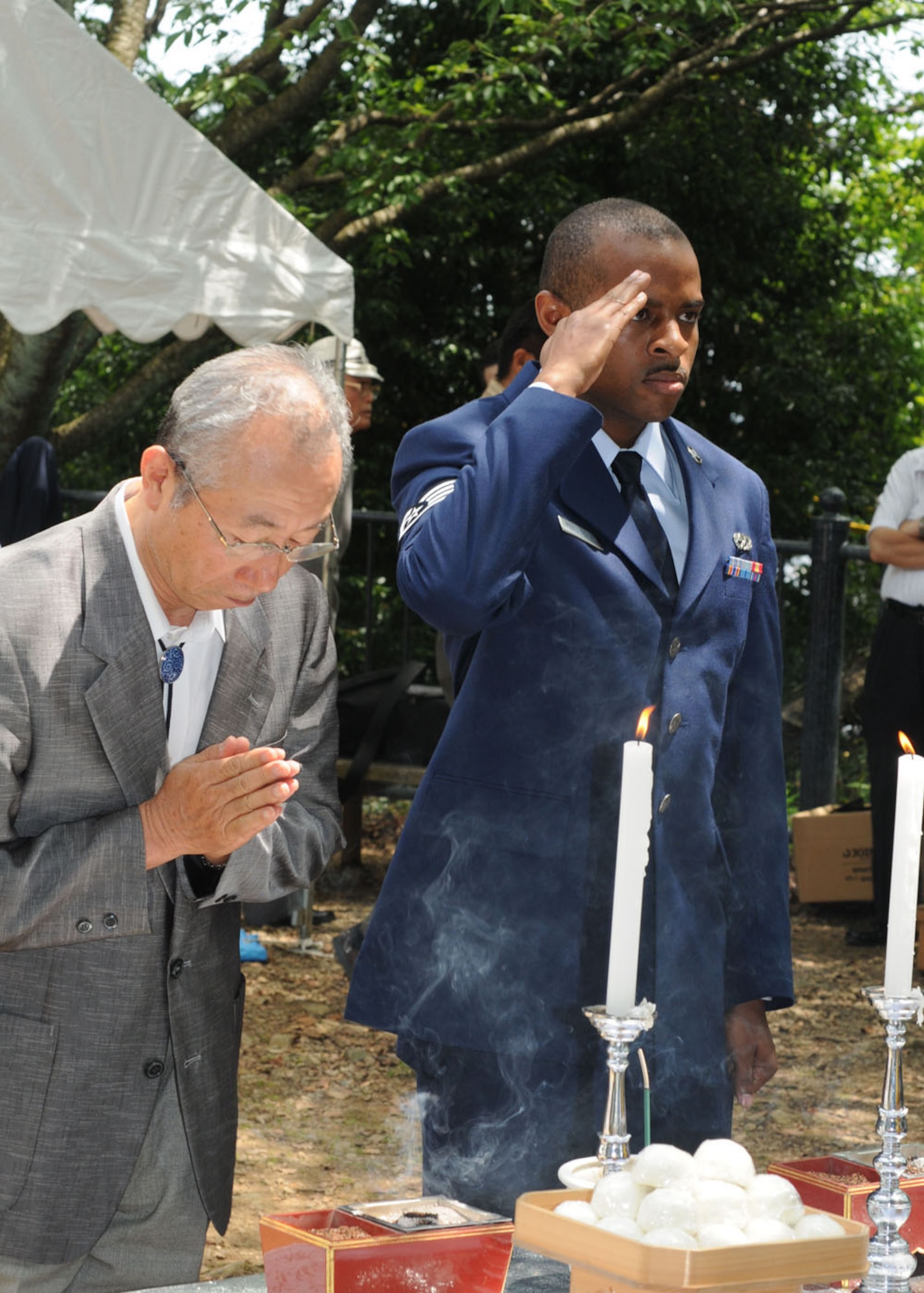 YOKOTA AIR BASE, Japan -- Staff Sgt. Marcus Mendinghall, 374th Maintenance Squadron, offers a salute to the B-29 memorial on Mt. Shizuhata June 20. Since 1972, Yokota Airmen have participated in the US-Japan joint memorial service for the victims of the crash. (U.S. Air Force photo/ Staff Sgt. Veronica Pierce)