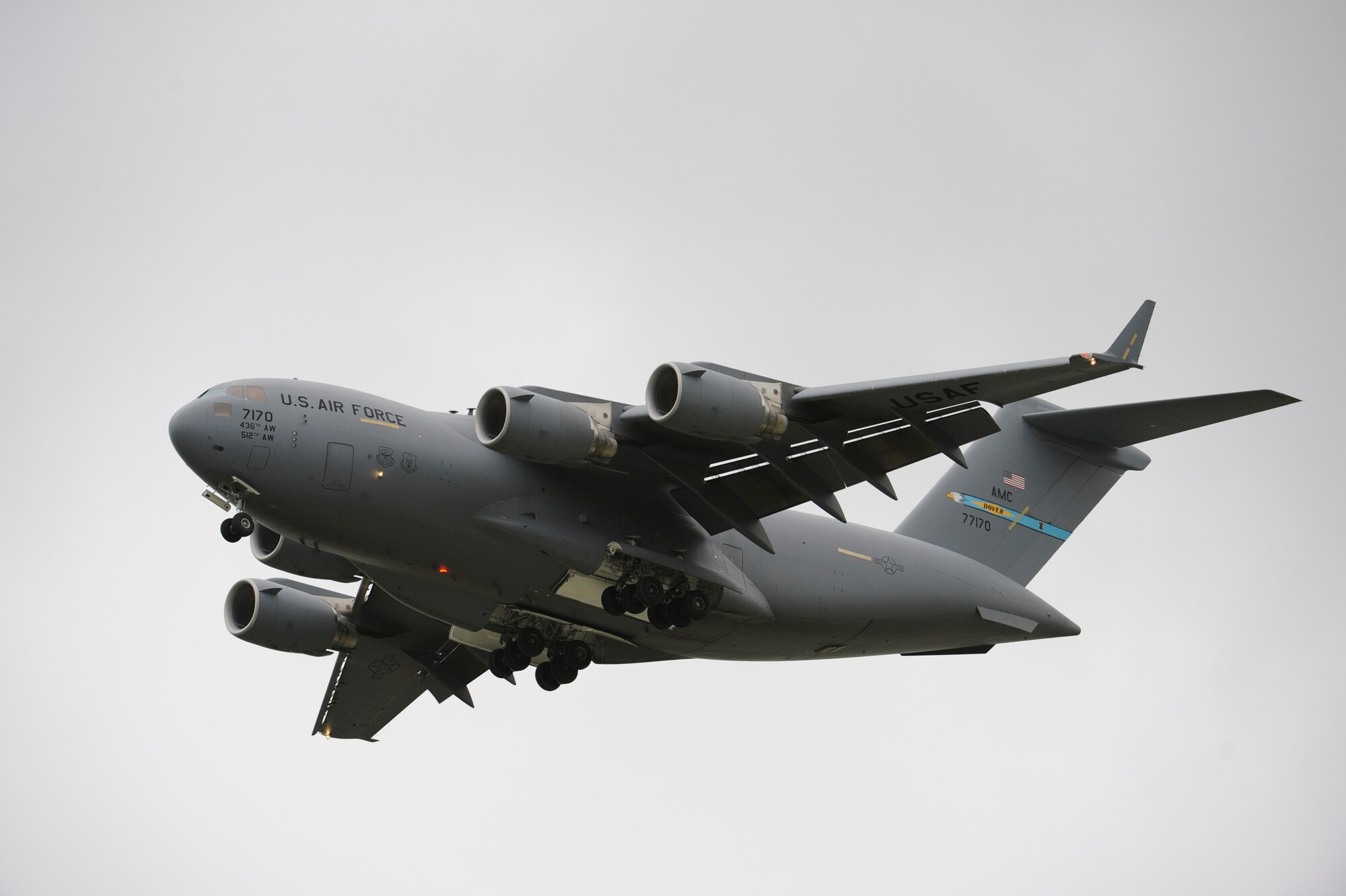 Dover's own C-17 Globemaster III parades over show center for the audience at the Dover Air Force Base Open House and Air Show June 21. Majs. Paul Theriot and Lucky O'Connell, 3rd Airlift Squadron, piloted the C-17. (U.S. Air Force photo/Jason Minto)