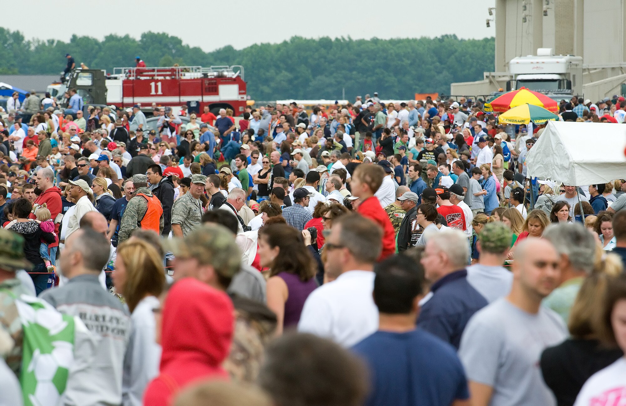 Spectators watch aerial demonstrations at the 2009 Dover Air Force Base Open House and Air Show June 21. According to early estimates, approximately 75,000 spectators attended the 2009 Dover AFB Open House and Air Show. (U.S. Air Force photo/Tom Randle)