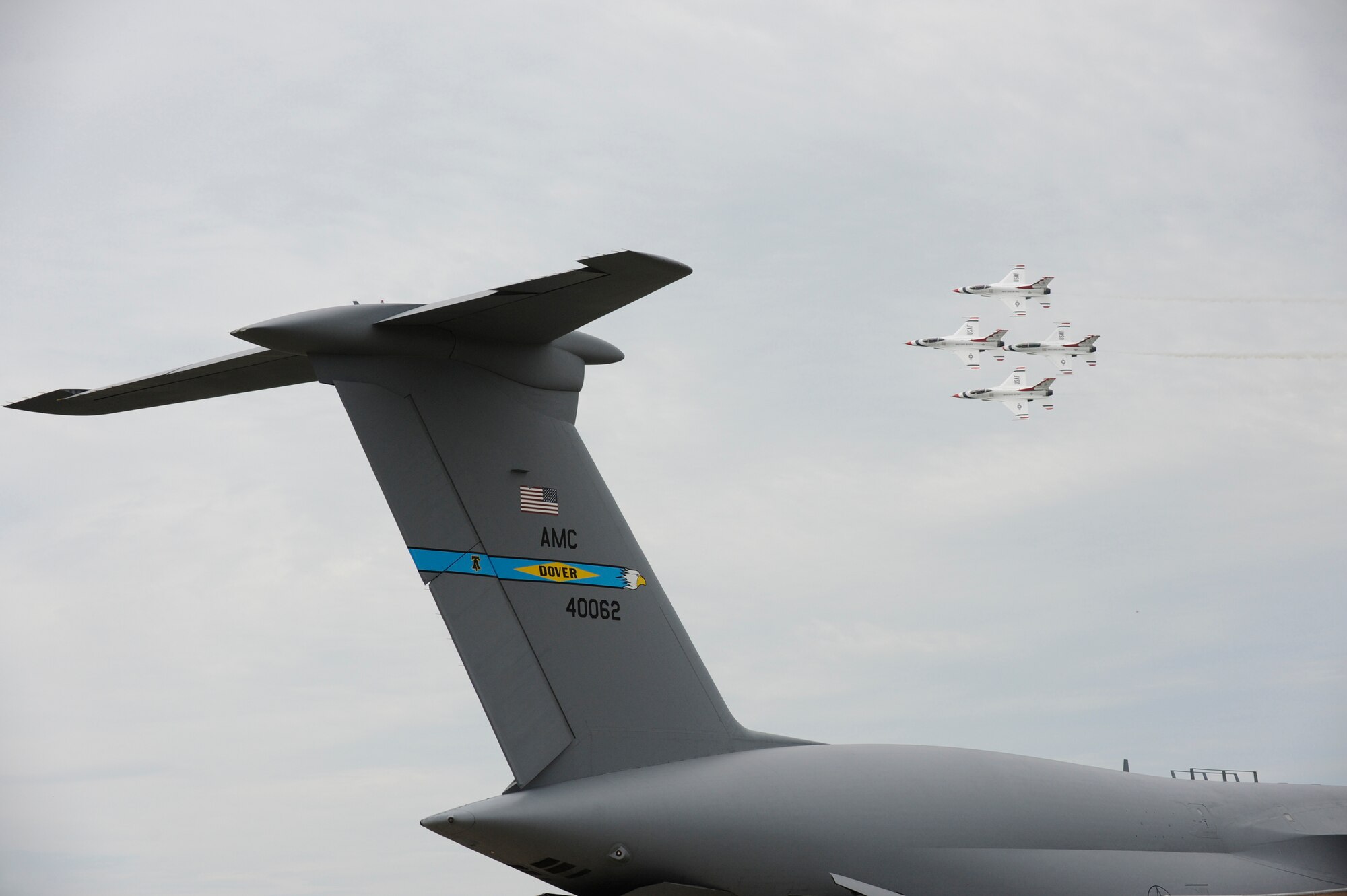 The Thunderbirds, the U.S. Air Force Aerial Demonstration Squadron, pass over a C-5 Galaxy at the Dover Air Force Base Open House and Air Show June 21. (U.S. Air Force photo/Jason Minto)