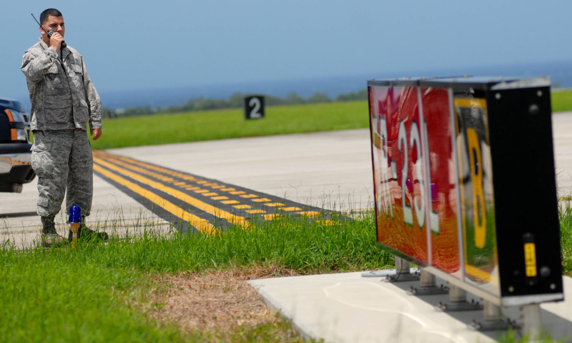 Staff Sgt. Jose Rios, 18th Operations Support Squadron airfield management, contacts the air traffic control tower for clearance to drive on the airfield runway June 23 at Kadena Air Base, Japan.
(U.S. Air Force photo/Tech. Sgt. Rey Ramon)    