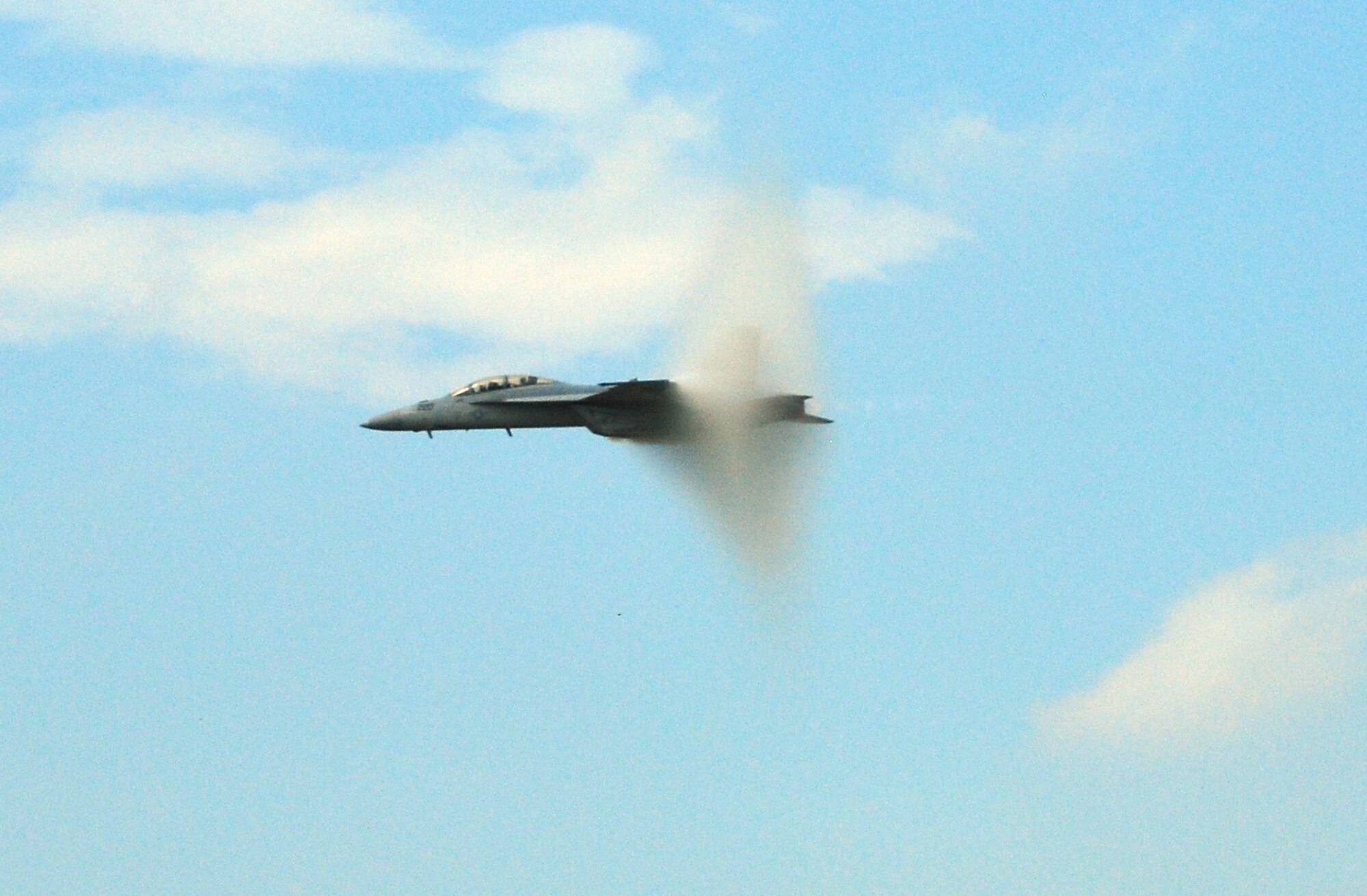 A Navy F/A-18 Super Hornet demonstrates its capabilities to the spectators at the 2009 Dover Air Force Base Open House and Air Show. Crowds still enjoyed the demonstrations and static displays after rain washed out the morning portion of the show. (U.S. Air Force photo/Staff Sgt. Steve Lewis)