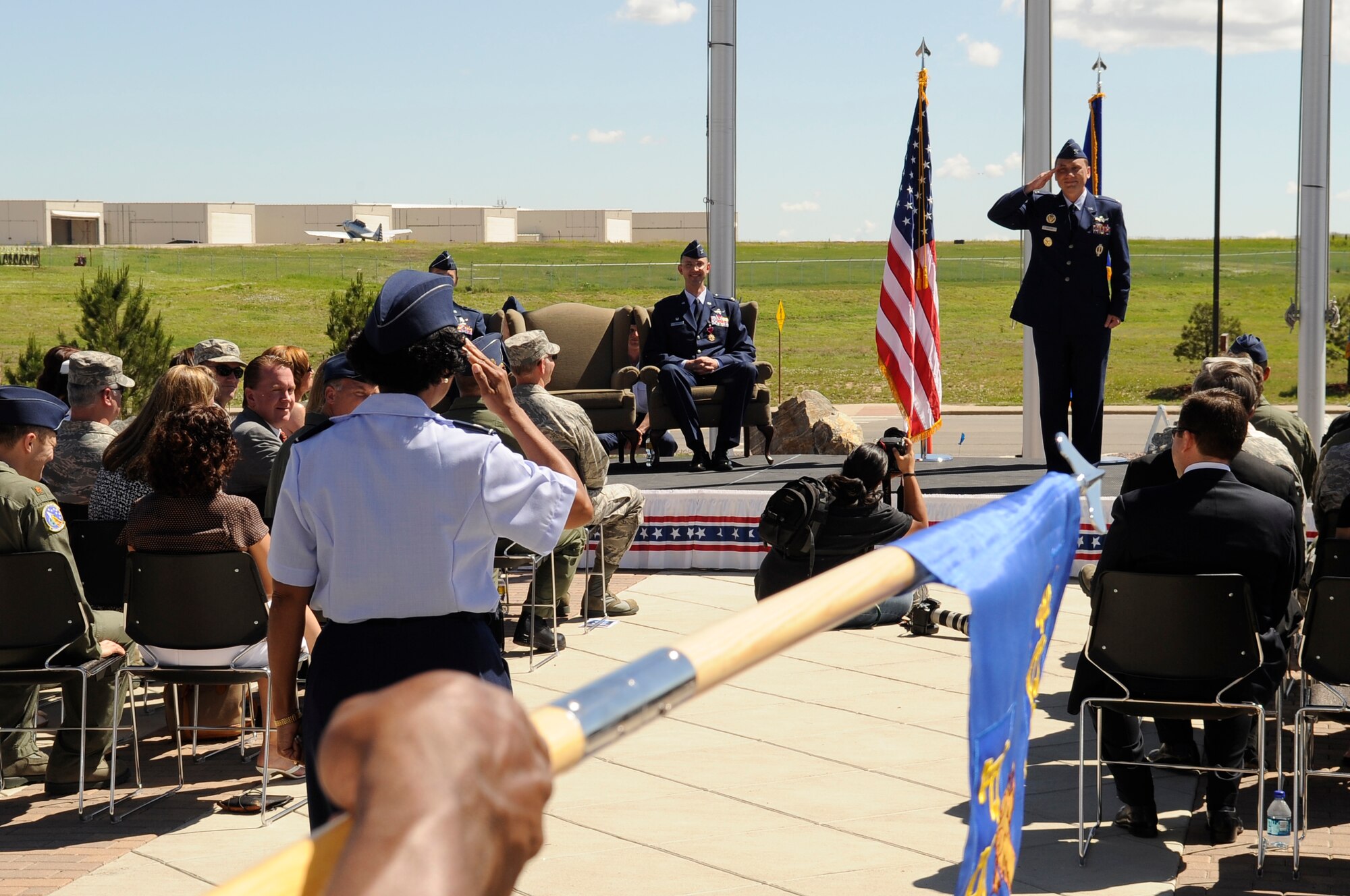 BUCKLEY AIR FORCE BASE, Colo. – Col. Clinton Crosier receives his first salute as the 460th Space Wing commander from Col. Charlotte Wilson, 460th SW vice commander during an official ceremony here, June 19.  Colonel Crosier was previously the Deputy Director of Plans and Programs, Headquarters Air Force Space Command, Peterson AFB, Colo.  (U.S. Air Force photo by Senior Airman Steven Czyz)