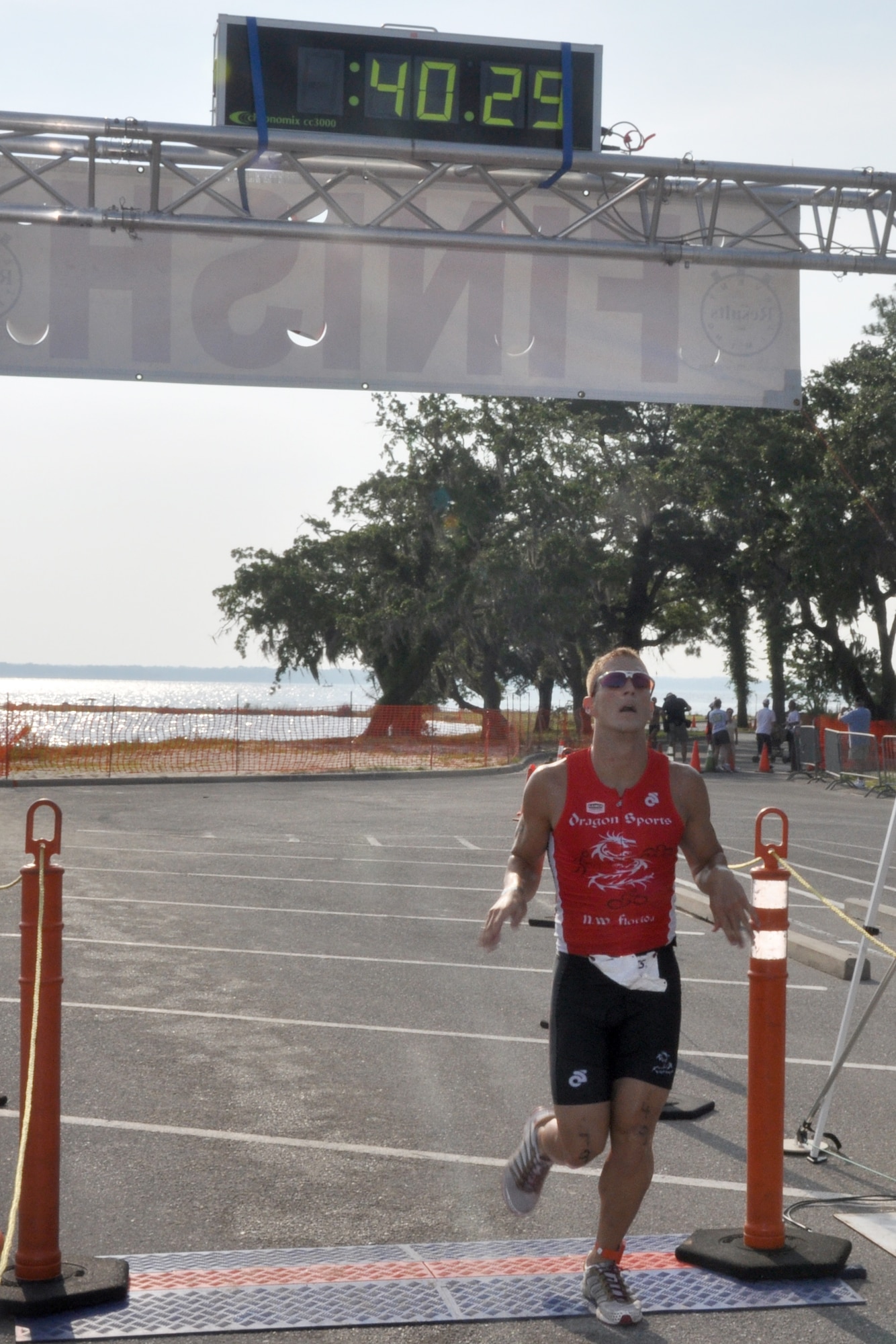 EGLINAIR FORCE BASE, Fla. --  2nd Lt. Mitchell Kieffer, Air Force Research Laboratory, crosses the finish line placing first in 40:29 at the 10th Annual My First Tri triathlon at Post’l Point June 20. The triathlon featured a 200-meter swim, 8-mile bike ride and 2.5-mile run. Wendy Ewing finished first in the overall women’s division with a time of 47:57. 1st Lt. Scott Eberle, 86th Fighter Wing Squadron (49:50) and Colleen Riddle (53:40) finished first in the first timers division. 122 first timers and 132 alumni participated in this year’s event. (U.S. Air Force photo/ Airman Anthony Jennings)