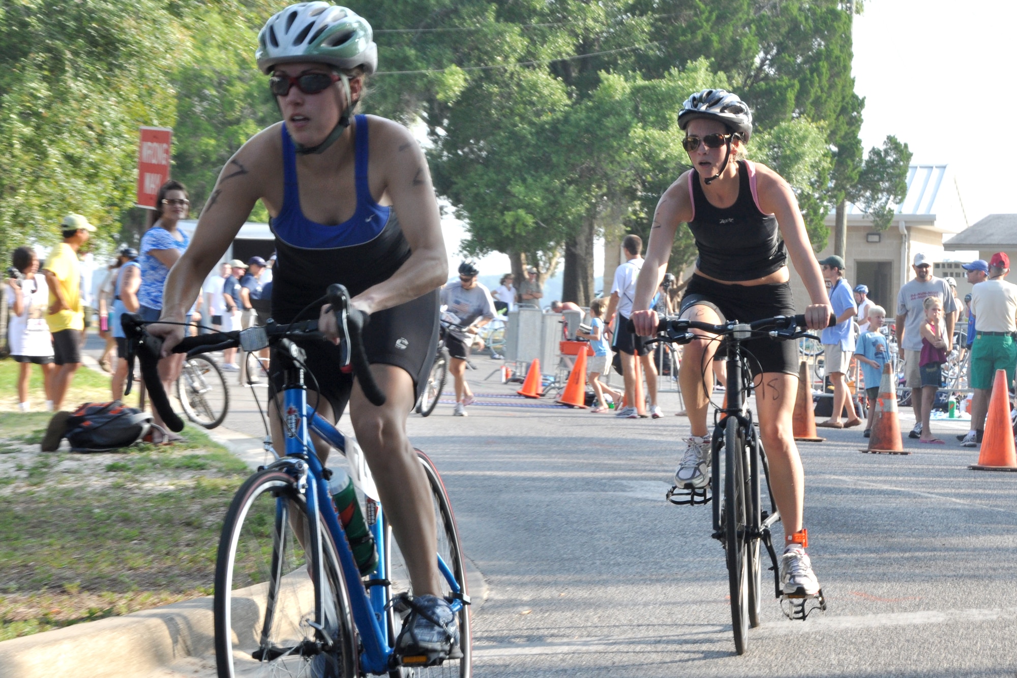 EGLIN AIR FORCE BASE, Fla. --  Two tri-athletes begin the bike portion of the 10th Annual My First Tri triathlon at Post’l Point June 20. The triathlon featured a 200-meter swim, 8-mile bike ride and 2.5-mile run. 122 first timers and 132 alumni participated in this year’s event. (U.S. Air Force photo/ Airman Anthony Jennings)