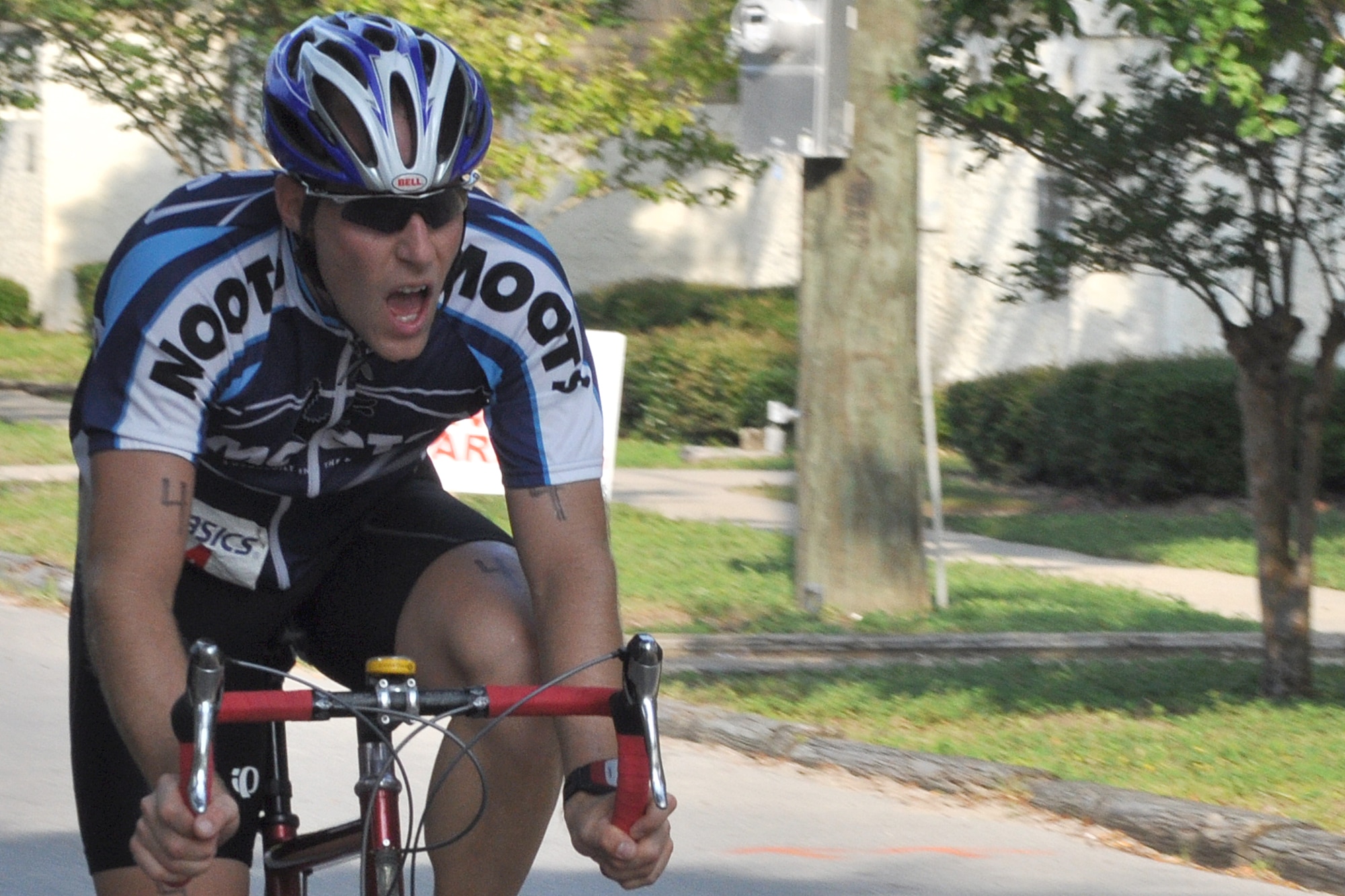 EGLIN AIR FORCE BASE, Fla. --  A tri-athlete pedals hard coming down the final stretch of the bike portion of the 10th Annual My First Tri triathlon at Post’l Point June 20. The triathlon featured a 200-meter swim, 8-mile bike ride and 2.5-mile run. 122 first timers and 132 alumni participated in this year’s event. (U.S. Air Force photo/ Airman Anthony Jennings)