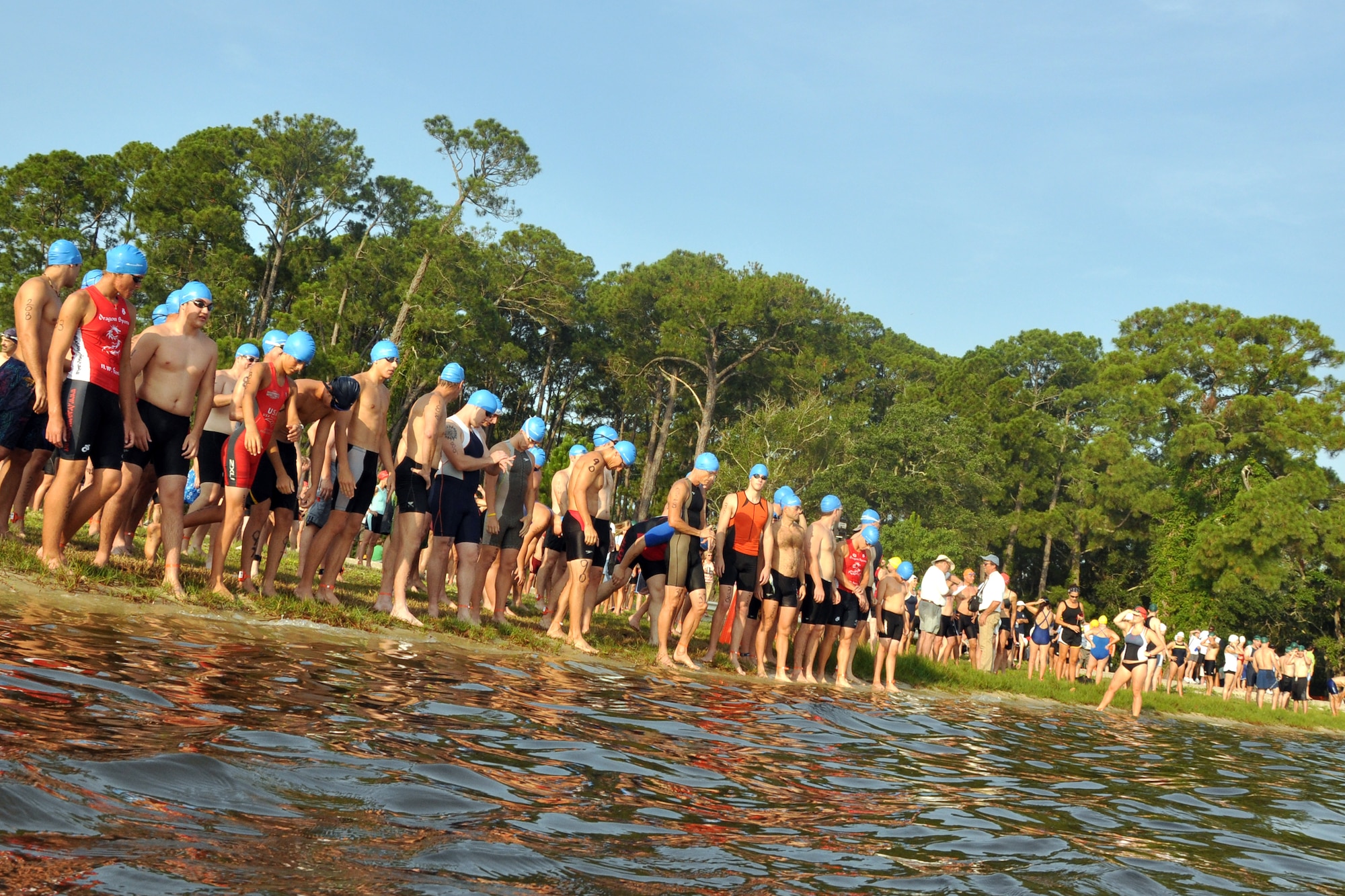 EGLIN AIR FORCE BASE, Fla. --  The first wave of tri-athletes line up at the water at the 10th Annual My First Tri triathlon at Post’l Point June 20.  The triathlon featured a 200-meter swim, 8-mile bike ride and 2.5-mile run. 122 first timers and 132 alumni participated in this year’s event. (U.S. Air Force photo/ Airman Anthony Jennings)