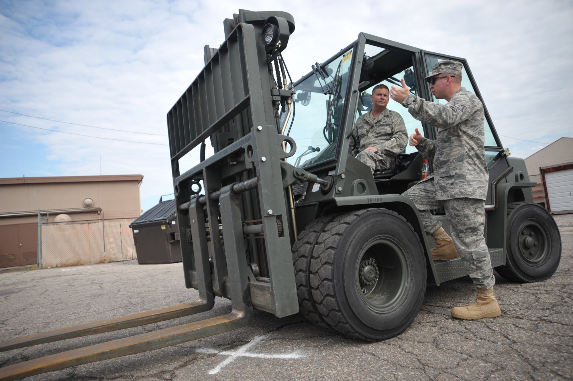 Tech. Sgt. Christopher Devoid offers some instruction to Master Sgt. Leo Ritter while training with a forklift during the 931st Air Refueling Group's drill weekend in June. Both sergeants are assigned to the 931st Civil Engineer Squadron, an Air Force Reserve unit at McConnell Air Force Base, Kan. (U.S. Air Force photo/Tech. Sgt. Jason Schaap)