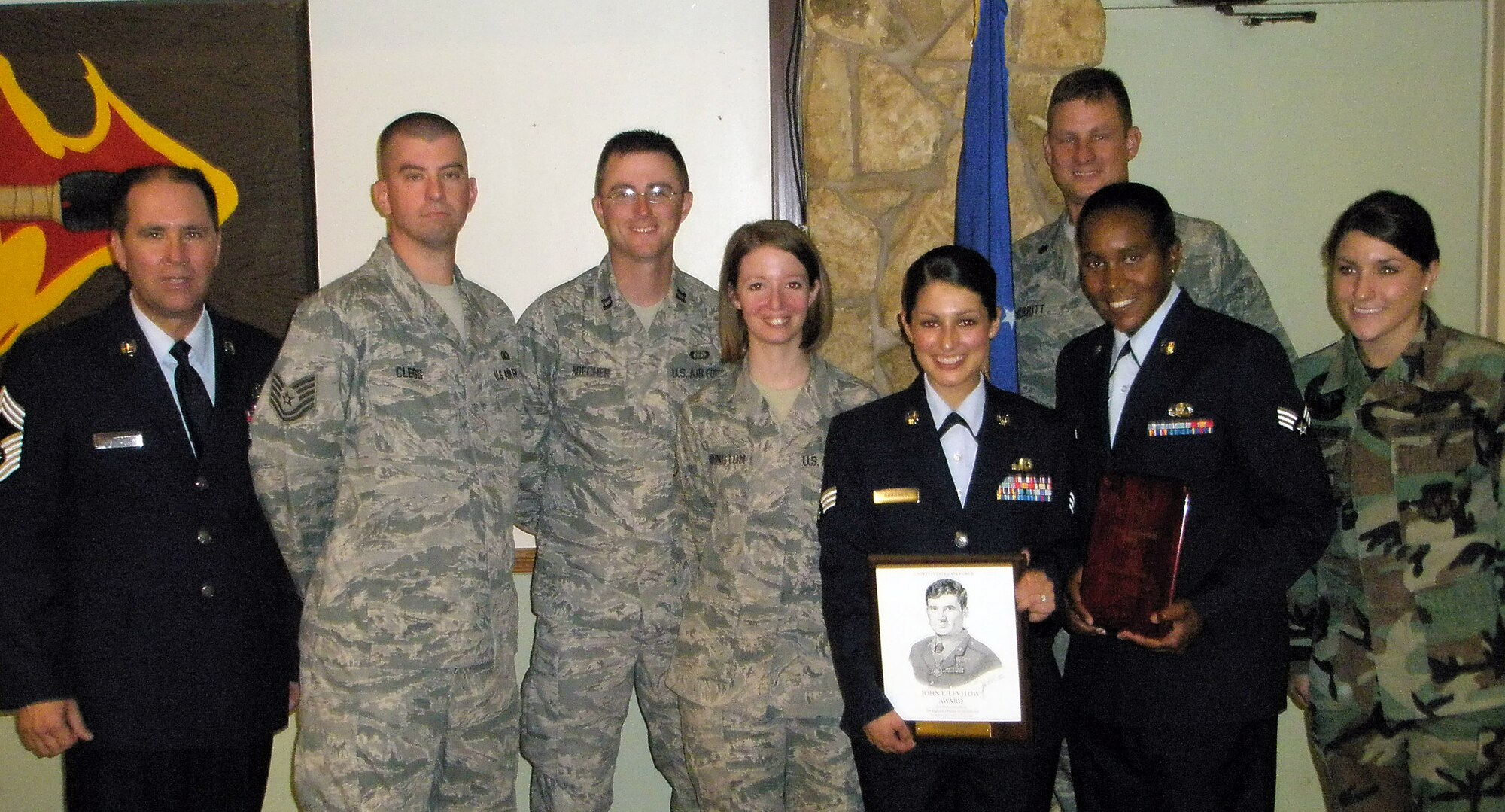 Ghostriders from Vance’s 71st Operations Support Squadron went to Altus AFB, Okla., June 12, to witness the graduation of two of their people from Airman Leadership School. Senior Airman Nina Gardner, third from right in service dress, an air traffic controller in the Radar Approach Control, earned honors as the Levitow Award winner. Senior Airman Melissa Thomas, second from right in service dress, an observer in the Weather Flight, received the Academic Achievement Award. Also attending from left, are Chief Master Sgt. Richard Johnston, Tech. Sgt. Jonathan Clegg, Capt. Paul Koecher, Staff Sgt. Nicole Harrington and on far right, Senior Airman Laura Donaldson. In the back row is Lt. Col. David Merritt, commander of the 71st OSS. (Photo/Rob Ochs)