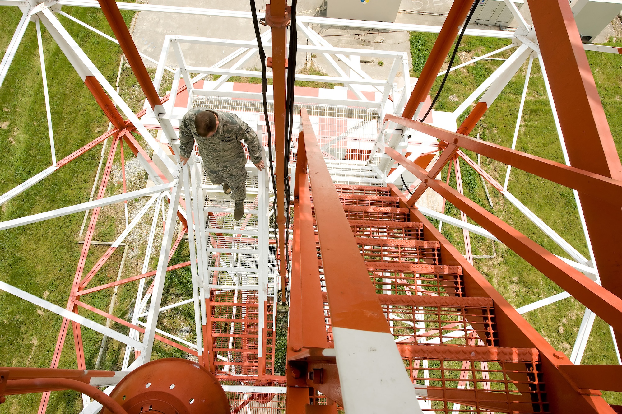 Staff Sgt. Josh Wilfong, 436th Communications Squadron ground radar systems technician, descends the radar tower after performing required daily inspections. (Air Force photo/ Jason Minto)